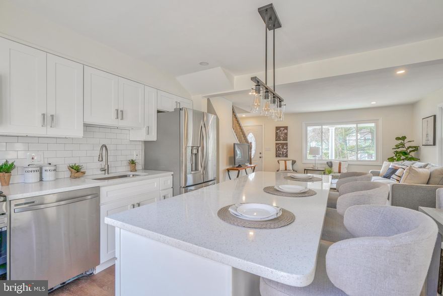 Completely rehabbed house in Towson.  Move-In Ready. Fully Renovated Professionally with *Building *Electric* Plumbing* permits. 4 beds, 3 full baths. Primary bedroom suite  on 2nd level with attached bath, huge walk-in closet, and sitting/office area.   *New Roof with gutters and downspout *New Siding *All new electrical wiring in the entire house with the new electric panel, *All new plumbing in the entire house, *New kitchen with white cabinets and quartz countertops SS appliances, *New Deck. *New Driveway *All 3 bathrooms are new.  *New Insulation. Schedule your showing. This is a MUST-SEE Property!