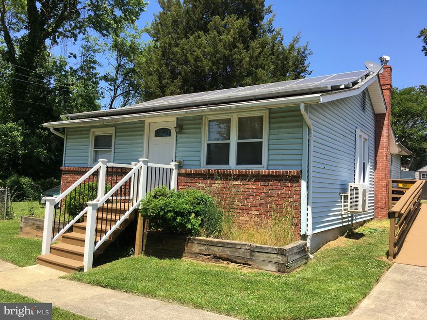 Cottage on level, double lot being sold AS IS. Needs kitchen & bath upgrades and some flooring replacement in the living room. Home has been completely outfitted for handicap accessibility including entrance ramp, roll in shower with hoist & comfort level raised toilet. Interior has been freshly painted. Newish electric range/oven. New well installed in 2018. Solar panels are owned and were installed with a new roof in 2011. Portable generator and LG combination front load washer/dryer convey. Access to crawl space located in rear BR closet. Selby On The Bay is a special tax district. Community amenities are just a short walk away and include marina, clubhouse,  private beach, boat ramp, playground, ball fields & basketball court. Adjacent lots 40, 41 and lot 12 across the street will remain unimproved. They have been donated by the same owner to Crownsville Conservation. Do not attempt to operate the dishwasher...hoses may have rotted.