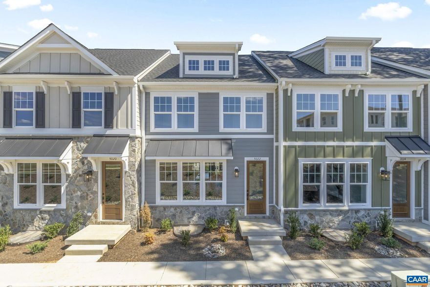 Just completed and move-in ready! This finished Dogwood townhome in Dunlora Park is ready for its first owner. Set just minutes from Downtown Charlottesville, this farmhouse-style, earth-friendly townhome offers two finished stories plus a basement with a rec room, half bath, and rear-entry 2-car garage. Inside, you?ll find no carpet anywhere?just durable LVP flooring throughout the bedrooms and living spaces. The open main level features a gourmet kitchen with a wall oven, hood vent, custom cabinetry, oversized central island, walk-in pantry, and stainless steel appliances. Upstairs are the primary suite, two additional bedrooms, a full hall bath, and laundry. Other quality finishes include oak stairs, solid core doors, wood shelving, upgraded trim, and an energy-efficient furnace. Actual photos!,Granite Counter,Maple Cabinets,Painted Cabinets,White Cabinets