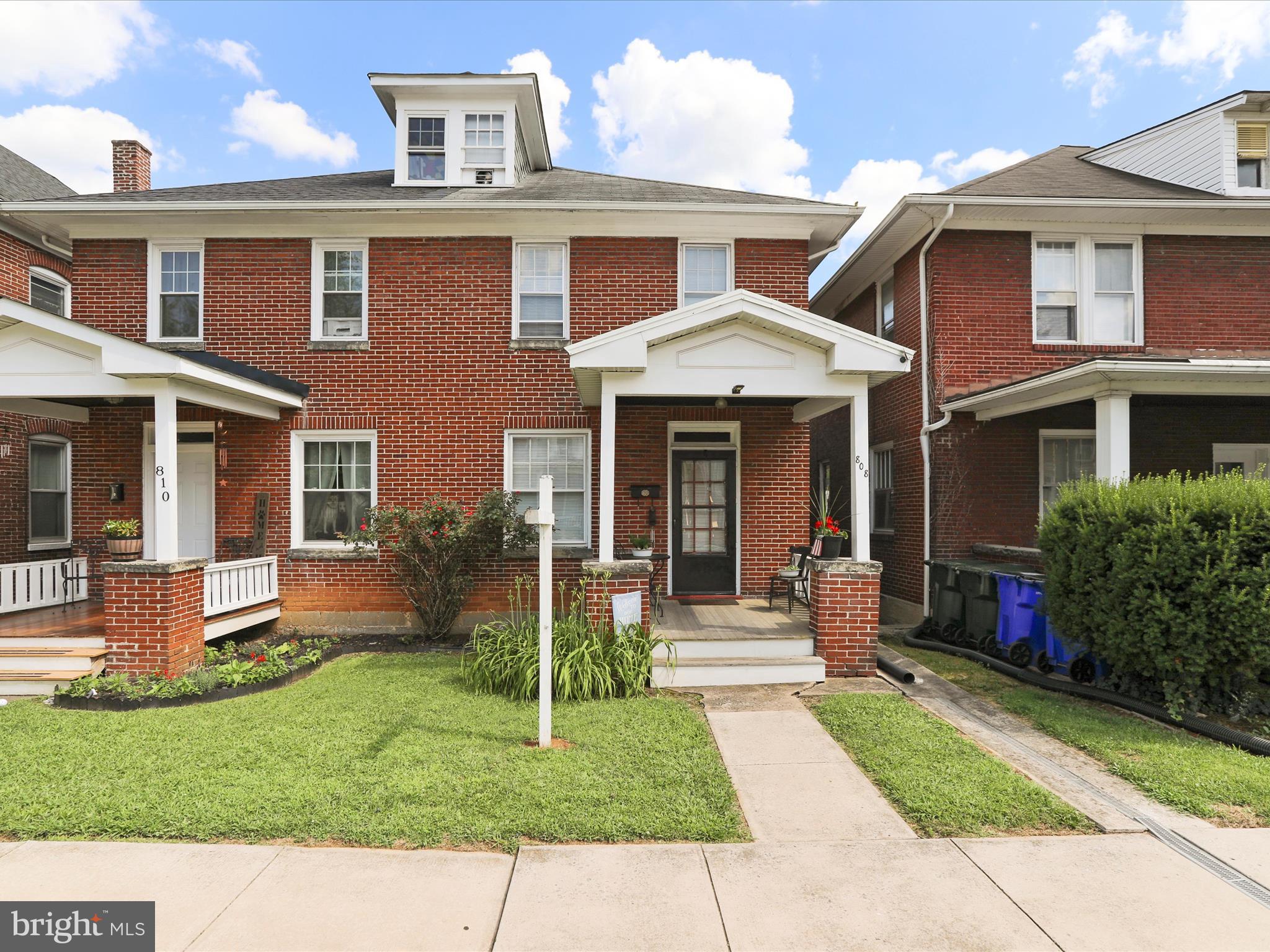 Welcome to this beautifully restored brick home, perfectly blending timeless charm with thoughtful updates. Featuring rear parking for two vehicles and an oversized detached garage, this property offers both convenience and functionality. Inside, you'll find high ceilings, refinished hardwood floors, and a stunning kitchen with soft-close cabinetry, dovetail drawers, premium granite countertops, and stainless steel appliances. French doors connect the living and dining rooms, creating a warm and inviting space ideal for entertaining. The home also boasts a mahogany front porch and a covered back porch off the kitchen for relaxing outdoor living. A walk-up attic offers potential to be finished into a playroom, office, or additional living space, while the basement with a concrete floor is ready for future expansion. With exceptional craftsmanship and custom details throughout, this home is truly one of a kind.