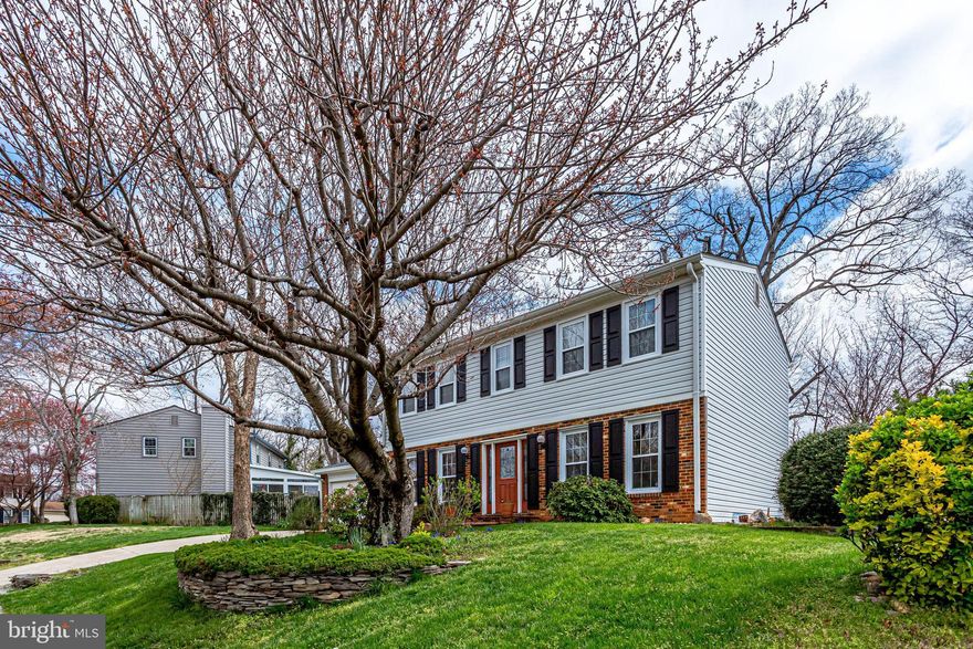 Large colonial with gorgeous lot! Beautiful 3 bedroom with sitting room colonial with three full levels of living space and large sun room. Fenced yard with lovely stone landscaping, tons of blooming bulbs, and backs to trees! Great deck for entertaining, entrance to sun room as well as garage. Inside,the kitchen features maple cabinets, Corian counter tops and brand new stainless steel appliances. Entrance to family room has been widened for a more open feeling. Wonderful full wall of built in bookshelves surrounds the wood burning fireplace. Large sun room addition has amazing views from any vantage point! Finished lower level features rec room with custom built in bar, office built in desk and shelving, large closet under steps, and huge utility room for storage and laundry. There is room to finish off another room in the lower level even! The upper level features 3 large bedrooms, including master withsitting room (was a 4th bedroom) custom master bath and large walk in closet. Neutral carpet and freshly painted - plus 4 year old heat pump, and brand new roof! Special touches throughout this home make it so special. Such as the propane fireplace in sunroom, custom rod iron railing up the indoor stairs, skylight in upper hallway, flipable gutters on the entire back of house, and even a rain barrel for watering the garden. Close to Old Town Alexandria, 495, and three metro stations. Do not miss this hidden gem in Clermont school district!