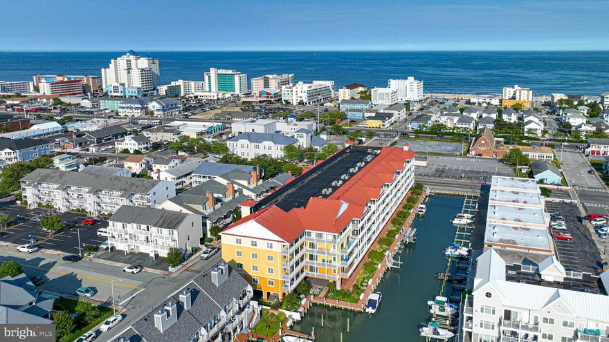 Introducing a stunning new real estate listing that boasts an array of desirable features, perfect for those seeking a vibrant coastal lifestyle. This exquisite unit is located in a prime waterfront location, offering  canal views that will leave you captivated. As you step inside, you'll be greeted by an inviting open floor plan, creating a sense of spaciousness and allowing for a seamless flow between rooms. The interior is designed to be bright and airy, filled with natural light that filters through large windows, enhancing the overall ambiance of the space.  With its southern exposure, this unit enjoys an abundance of sunshine throughout the day, creating a warm and inviting atmosphere. The carefully selected stainless steel appliances in the kitchen add a touch of modern elegance while providing the functionality and durability that discerning homeowners seek. Imagine cozy evenings spent in front of the gas fireplace, creating a soothing and intimate setting in the living area. This desirable feature adds both warmth and style to the space, perfect for creating memorable moments with loved ones. Convenience is at your fingertips with this unit's close proximity to the boardwalk, restaurants, and amusements. Whether you're craving a leisurely stroll along the waterfront, a delightful culinary experience, or a fun-filled day exploring nearby attractions, everything is just a stone's throw away. This exceptional real estate opportunity offers a unique combination of waterfront living, captivating views, open living spaces, modern amenities, and easy access to a vibrant coastal community. Don't miss out on the chance to make this unit your own and experience the best that coastal living has to offer.  Improvements include, Stainless Steel  Kitchen Aid appliances, Dishwasher 6/2023, microwave 7/2022, Stove 7/2022, Refrigerator 2020.  Kitchen updated  with quartz counters, custom cabinets, and tiled backsplash 10/2021. Luxury Vinyl Plank floors 7/2019, Canadel Dining Set 1/2022, Master Bedroom Bassett Furniture 2/2022, Indoor and outdoor HVAC units 3/2021, 55-Gallon leak protect hot water heater 3/2023, 10-year Smoke Detector X 5 and Carbon Monoxide Detector in LR  1/2021 and painted interior walls, trim, ceilings, and doors in 9/2019.