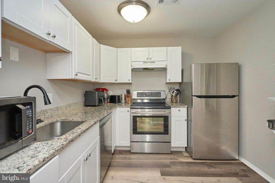 CHARMING 2-BEDROOM COURTYARD CONDO WITH MODERN UPGRADES AND FANTASTIC AMENITIES!
Welcome home to this beautifully updated 2-bedroom, 1-bath condo nestled in a serene courtyard setting. This property features a modern kitchen with updated cabinets, countertops, and LG stainless steel appliances. The updated bathroom, fresh paint, and luxury vinyl plank (LVP) flooring make this home move-in ready! HVAC replaced in 2025. In-unit washer/dryer. Enjoy the convenience of in-unit laundry with a washer and dryer, attic access for additional storage, and new windows providing ample natural light. Step out onto your private balcony overlooking the peaceful courtyard—a perfect spot to relax. This condo includes access to an array of Lake Ridge amenities: five community pools, tennis, volleyball, and basketball courts, walking paths, tot lots, spray grounds, picnic areas, and more! Nearby attractions include the Lake Ridge Marina, a Par 3 Golf Course, and numerous parks for recreation. Commuters will love the easy access to I-95, Route 123, VRE, and proximity to Potomac Mills, Stonebridge, and local dining and shopping options. Water, sewer, and trash removal are included, and ample parking makes living here hassle-free. Don’t miss this opportunity to enjoy this gem of a condo in a prime location!