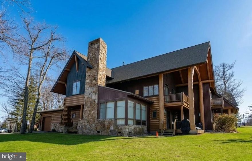 Experience the ultimate mountain getaway at 93 Kendall Camp Circle in McHenry! This sought-after ski-in/ski-out duplex offers direct access to Chair Lift #4 at Wisp Resort—making it a dream location for winter enthusiasts.  Step inside to find a warm and inviting interior featuring a wood-burning fireplace—perfect for unwinding after a day on the slopes. Offering over 3000 square feet with 4 bedrooms and 4 full bathrooms, there is plenty of space to relax. Enjoy the outdoors from both covered upper and lower decks, offering year-round space to relax or entertain. Soak in the hot tub while taking in the mountain setting. Enjoy filtered lake views through the oversize windows the main level living room.  Additional highlights include an attached one-car garage with storage lockers, an oversize mudroom, new HVAC and new hot tub! Whether you're looking for a personal retreat, vacation home, or investment property, this unit is a great option for all of these options. Enjoy easy access not only to skiing, but also to nearby Deep Creek Lake, golf, dining, and outdoor recreation. Don’t miss this opportunity to own a slope-side property in one of McHenry’s most desirable locations!