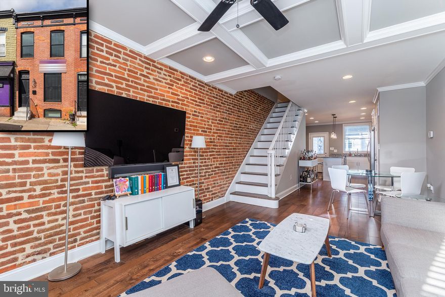 CHAP TAX CREDIT RENOVATION W/ EXPANSIVE REAR ADDITION & INCREDIBLE VIEWS FROM ROOFTOP DECK  - stunning 4 year old renovation featuring hardwood floors throughout, exposed brick, coffered ceiling, crown molding & large island kitchen w/ ss appliances & granite counters leading to private rear covered porch great for entertaining!  Upper level offers huge owner's suite with dual vanities & large luxurious oversized bathroom w/ shower, convenient hallway laundry and hallway access to rooftop deck.  Completely finished lower level with 8' ceilings offers two light filled bedrooms w/ walkout exit to parking pad - shows like new!  Approximately 6 years remaining on chap tax credit - currently taxes super low, only $2807/YEAR!!!