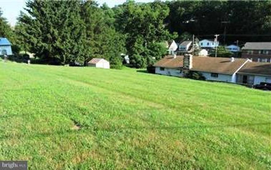 Very nice open lot in the historic town of Berkeley Springs with water and sewer. This .17 ac lot is a corner lot and ready to build on. Suitable for mobile, double wide, townhome, modular or stick built home. Close to shops, schools and activities.