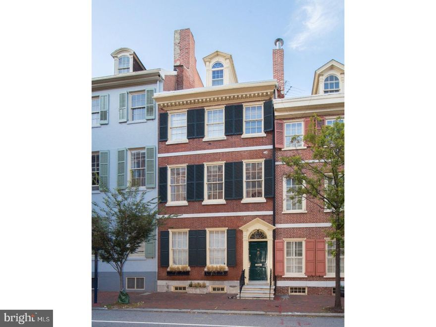 Unique opportunity! Center City house on iconic Wash West block has the charm of an elegant historic home with high-quality modern updates. This handsome, restored original, 3 window-wide, Society Hill home features 6 bedrooms, 4 full baths and 1 half bath, a garden oasis, sundeck and two car parking. The front hallway, lighted by Edwardian archtop lanterns, reflects Society Hill's Federal Period and leads you into a stylish, restored living room and dining room with four large windows, hardwood floors, detailed crown moldings, top lanterns and two original fireplaces, perfect for entertaining. The spacious Joanne Hudson kitchen is a warm and inviting room that contains wood beam ceilings, a fireplace, quartz and butcher block countertops, large island bar counter, and top-of-the-line appliances including a paneled Subzero refrigerator, double wall Bosch oven and cooktop and microwave drawer. Rear sitting/breakfast room offers two custom-built benches and a door out to the charming yard, complete with a wood trellis, and a slate and cobblestone garden ? a true urban oasis!! Beyond the trellis is space for 2-car parking and a remote-controlled garage door that opens onto Manning Street. On the second floor, you'll find a rear bedroom suite highlighted by a full tile bath and built-in shelving and cabinetry. This level also features a wide open den complete with a working fireplace, crown molding, two rear windows, and double French doors that lead into a bright front room, 3 windows wide that can be used as a bedroom, playroom or office. On the third floor are two additional bedrooms, including a rear bedroom with a door out to a sundeck, a modern bathroom with soaking tub and heated towel rack and a washer/dryer. The fourth floor offers two dormer bedrooms and a hallway bathroom. There is a separate staircase leading to a large guest room suite with a bathroom on the 3rd floor that is a tranquil space separated from the rest of the house, providing privacy for your guests or an au pair. The basement includes ample storage and an exercise room. This tremendous home offers the ultimate in size and scale, while located in a wonderful residential neighborhood just a stone's throw from historic parks, museums, great restaurants, cafes, transportation and more.