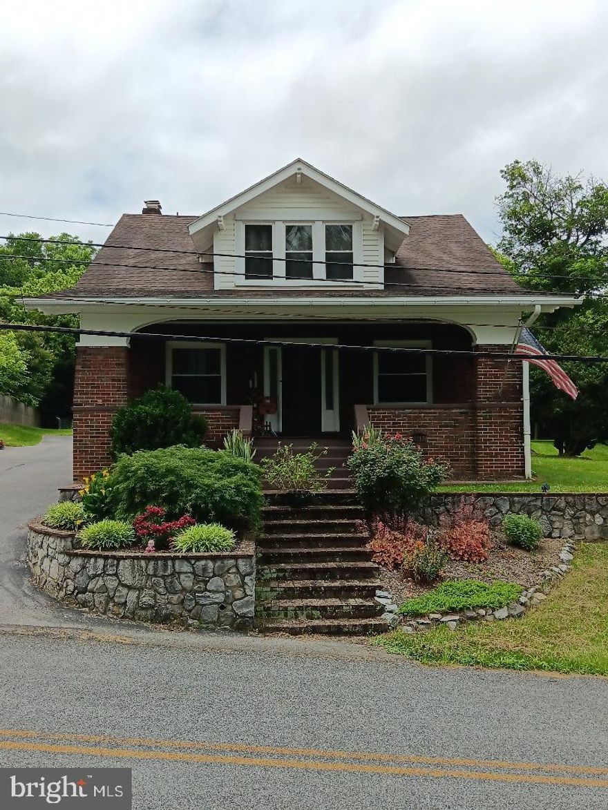 Price reduced, motivated seller. 3 bedroom, 2 full bath home in beautiful, quiet Williamsport, Md. This home is truly turn-key ready to move in. 2 story brick Cape Cod with a covered front porch and enclosed rear porch. Home sits on approximately 1 acre with a 50'x25' pole barn, with full cement floor and insulation. 1/2 the pole barn is climate controlled with heat and A/C. Outside the home features a very large paved driveway, fenced garden area, fruit trees, and multiple flower beds. Inside the home on the upper level there are 3 bedrooms, large master bedroom has 2 walk in closets, the other 2 large bedrooms each have walk in closets also. The full bath is all tile including a shower/tub combo, with his and hers sinks and all new cabinetry. On the main floor is a large enclosed back porch/mudroom with a heated tile floor. Step in to a large country kitchen with tons of cabinetry and a large solid surface (Corian) countertop. There's a formal dining room with laminate floor, a large living room and office/den both with Brazilian Cherry hardwood floors. There's a family room with carpeting and also another full bath featuring all tile and a stand up shower. In the full basement you'll find a natural gas furnace, new (February 2025) natural gas water heater, new water softener system, UV filter, and whole house sediment filter. The home is fully air conditioned by a central A/C system upstairs and by ductless mini-splits on the main level. All rooms on both floors feature ceiling fans and energy efficient vinyl clad windows.