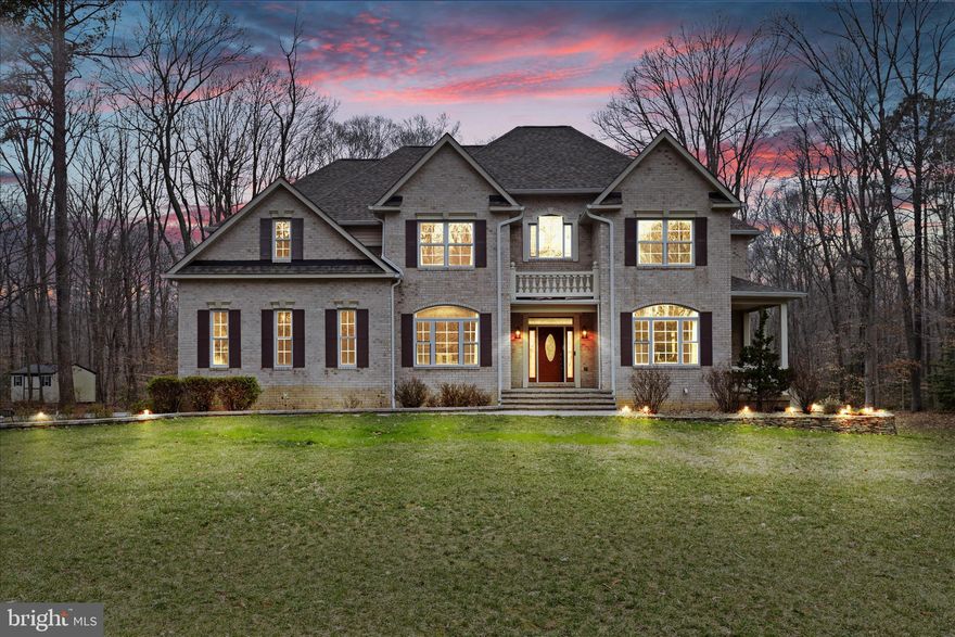 This beautifully updated Colonial offers over 6,000 square feet of thoughtfully designed living space on a private 1.1-acre lot, tucked at the end of a quiet cul-de-sac in Barakat Court.

What sets this home apart is not just the size or the setting, but the way it has been refined over time. The current owners have carefully improved the home with new flooring, a lighter and more cohesive color palette, custom ironwork, and recessed lighting throughout, creating a space that feels brighter, more open, and more connected.

The main level is designed for both everyday living and entertaining. At the center, the kitchen features a striking navy island, pot filler, and under-cabinet lighting that adds warmth and depth. It flows naturally into the surrounding living areas, where a gas fireplace anchors the space and large windows bring in natural light while overlooking the wooded backdrop.

The formal dining room offers a more refined setting for gatherings, complete with a built-in credenza with illuminated cabinetry that adds both function and character.

Just beyond the main living areas, a dedicated office or flex space provides versatility for work, study, or additional living. This room opens to its own private balcony, offering a quiet outdoor escape rarely found on the main level. A light-filled sunroom with a ductless mini-split further expands the main level, creating a comfortable space to enjoy year-round.

Upstairs, the primary suite offers a comfortable retreat with a walk-in closet and a well-appointed bath featuring heated floors. Additional bedrooms are generously sized, and the home offers more storage than it first appears, with closet space thoughtfully designed to maximize functionality.

The fully finished walkout basement adds significant flexibility and is well suited for multi-generational living or extended guest stays. It includes a full bedroom with a newly added closet, a full bath, a bar area, and a recreation space with a pool table that conveys. A separate room offers an ideal setup for a home gym, office, or additional flex space.

Outdoor living is equally compelling. The property features a screened-in porch, an open deck, and a lower-level patio, creating multiple spaces to relax or entertain. The expansive backyard offers ample room for a future pool or outdoor retreat, subject to HOA approval, while mature trees provide a sense of privacy that is increasingly difficult to find.

In addition to its aesthetic appeal, the home offers meaningful updates that provide long-term peace of mind, including two HVAC systems replaced in 2024 and 2025, updated windows in 2022, a roof installed in 2020, and the addition of a whole home generator. Additional improvements throughout reflect consistent care and investment.

Located within a small, established community with a low HOA and minimal traffic, this home offers a rare combination of space, privacy, and livability in today’s market.

For buyers seeking a move-in ready home that offers both flexibility and thoughtful design, this is an opportunity worth experiencing in person.