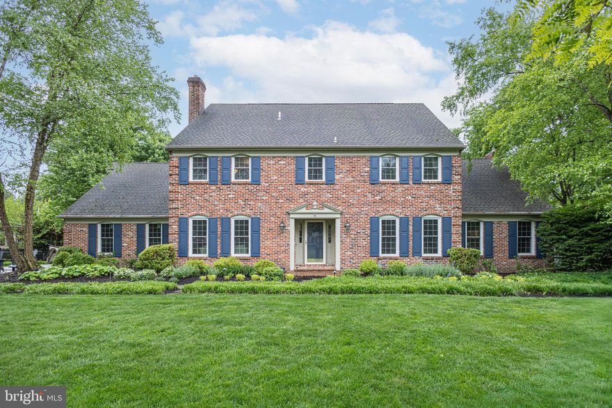 An exceptional neighborhood location, this impressive 4 bed, 2.5 bath brick façade home in sought-after Mirror Lake Farms offers a highly desirable floor plan along with numerous updates throughout that are sure to please. Set on a prime, one-acre lot in a quiet community, this center hall colonial combines the sense of coziness along with the perfect open concept for entertaining with its spacious rooms, two fireplaces and gleaming rich hardwood flooring. The entryway welcomes you with its gracefully turned staircase, anchored by the formal living and dining rooms, all of which are decorated with eye-catching, custom moldings and trim. Make your way down the center positioned hallway to the stunning, NEWLY remodeled Gourmet Kitchen and marvel at its expansive center island with seating for four, quartz countertops, abundance of cabinetry with attractive hardware, neutral pallet, breakfast nook, suite of stainless-steel appliances and openness to the neighboring family room. This “heart of the home” room boasts a beamed ceiling, floor-to-ceiling brick fireplace flanked by custom built-ins, and a paned French door entrance to a private home office; currently being utilized as a playroom. A set of double doors on the opposing wall of the family room overlook the lush green backyard giving access to a nicely sized, covered rear patio for seamless extended entertaining. Completing this level is a renovated half bath and newly designed laundry/mud room ornamented with custom built cubbies and bench making it convenient when entering from the 3-car garage or backyard. Upstairs at the top of the landing is the roomy primary suite featuring a “live in”, sprawling walk-in closet with a large island and beautifully designed custom built-ins. Find a sense of calm and luxury in the completely renovated, barn door entry main bath with its free-standing tub, roomy walk-in tiled shower with rain head, and dual sink vanity with attractive hardware throughout. You will never want to leave! Three other large bedrooms can be found on this level, all with double closets and a shared, updated hall bath. One of the bedrooms provides access to a huge walk-in attic area highlighting high ceilings and stair access to the garage below. This space, currently utilized as storage, could easily be transformed into a fifth bedroom, exercise room, sitting room or even a special hobby space. The opportunities are endless. Downstairs, the finished lower level offers additional living/recreational space and an abundance of storage. Additional amenities include New windows with transferable lifetime warranty, New gutter guards, New security system, New water softener, New carpet upstairs, Low property taxes and more! Located minutes from the I-295 corridor and Septa’s Yardley Train Station, making it a commuter’s delight. You will find plenty of shopping, dining and entertainment options with both Newtown and Yardley nearby as well as Shady Brook Farms and a new Wegmans right around the corner. What more could you ask for!