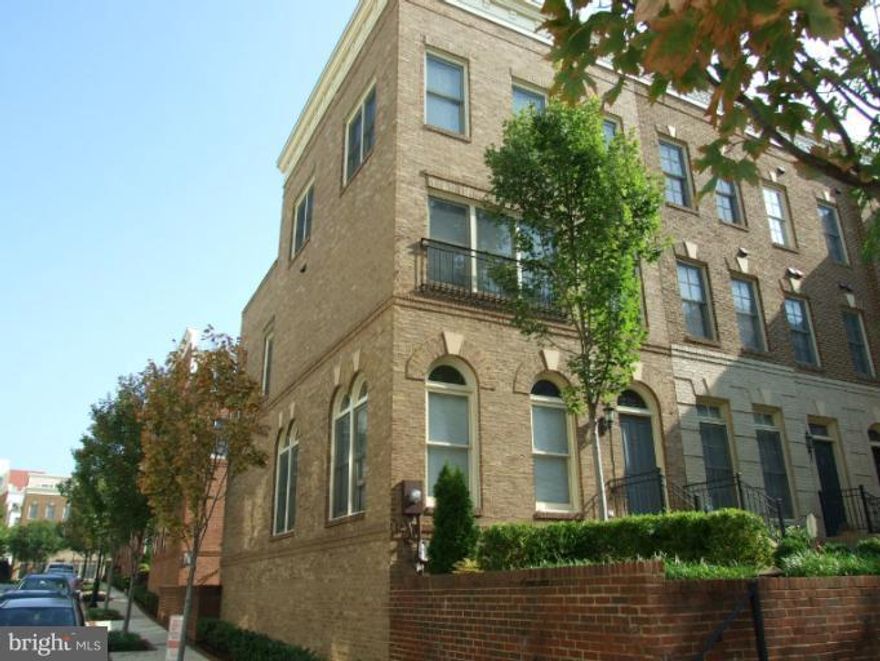 Upscale 4 level, end unit townhouse. 3 bedrooms, 3.5 baths, gourmet kitchen, hardwood floors, recreation room with fireplace, all bedrooms have private full bath, top floor suite with sitting room and roof top terrace. Brick exterior with 2 car garage. Super location. Walk to METRO and shopping.

These are old pictures...Kitchen is no longer green paint!  New pictures will arrive when the current tenant vacates on September 19th.