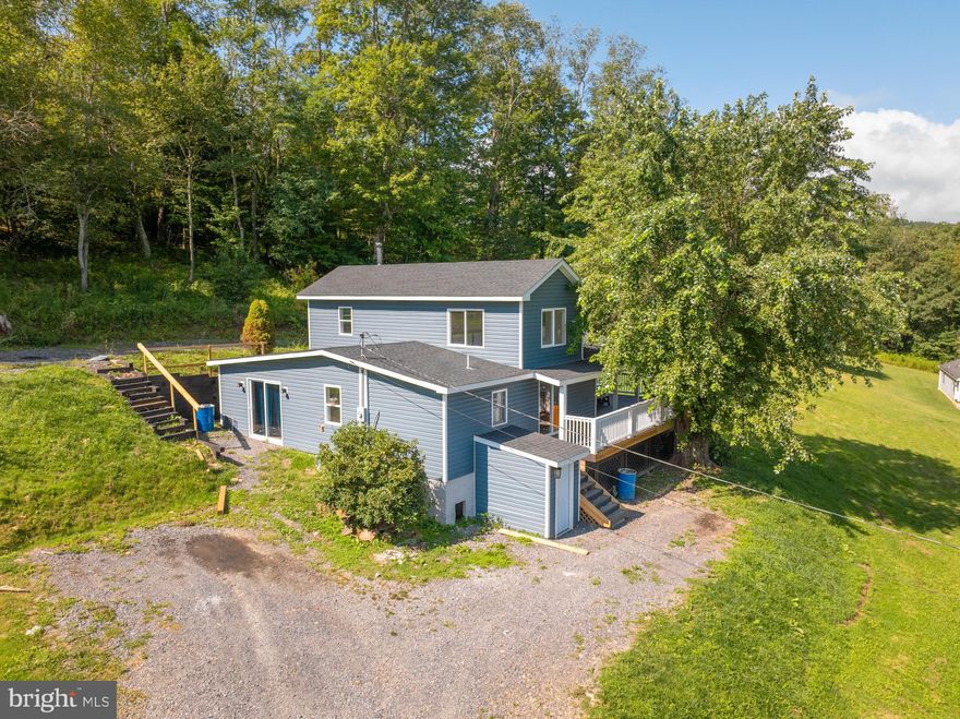 Check out this tremendous opportunity for an affordable home. Close proximity between Oakland, Mount Storm, and Thomas, WV This property is basically a brand new build from foundation to roof, totally renovated and remodeled in 2024 and ready for it's new owner! Featuring 3 bedrooms and one bathroom with a large bonus loft area that could be used as another bedroom or office space. The home also has a beautifully laid natural stacked stone fireplace with wood stove in the living room. A beautiful kitchen area with soaring ceilings, tons of natural light, and sliding door access to the deck where you'll find a partially roofed area with views of mountain and farm land off the front. The home also features newer stainless steel appliances including a combination Washer/Dryer in the laundry area. Call Today to schedule a showing!