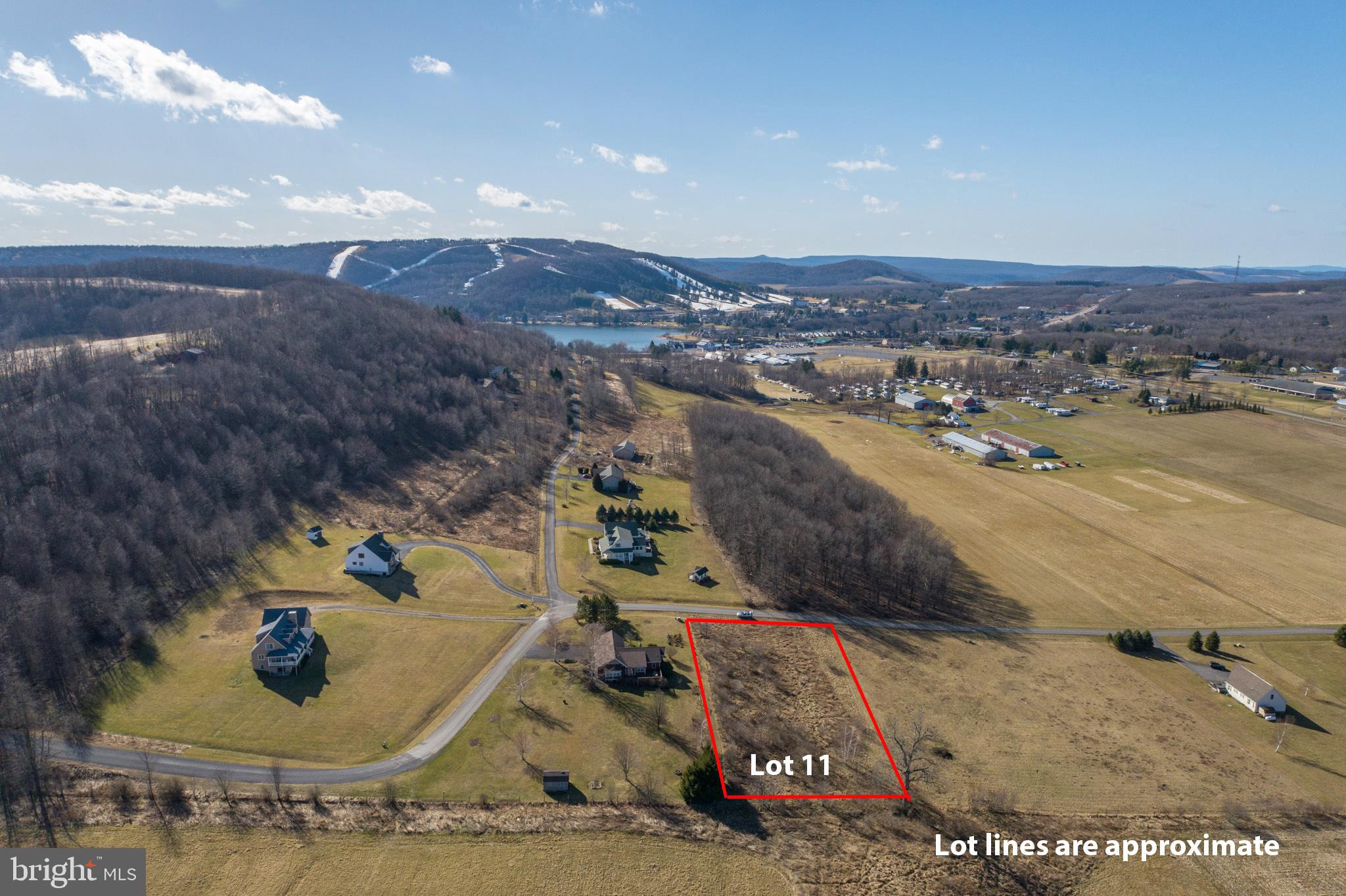 A stunning, level 1+ acre building lot with views in every direction and public water/sewer on site. Enjoy expansive sunrise and sunset views from this incredible piece of property that sits only minutes from Deep Creek Lake and McHenry, MD. An ideal location for the 4th of July fireworks show with views of the Wisp as well! A perfect spot for your eventual mountain getaway or full time residence. Call now for more details!