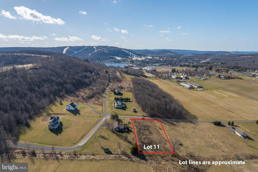 A stunning, level 1+ acre building lot with views in every direction and public water/sewer on site. Enjoy expansive sunrise and sunset views from this incredible piece of property that sits only minutes from Deep Creek Lake and McHenry, MD.  An ideal location for the 4th of July fireworks show with views of the Wisp as well! A perfect spot for your eventual mountain getaway or full time residence.  Call now for more details!
