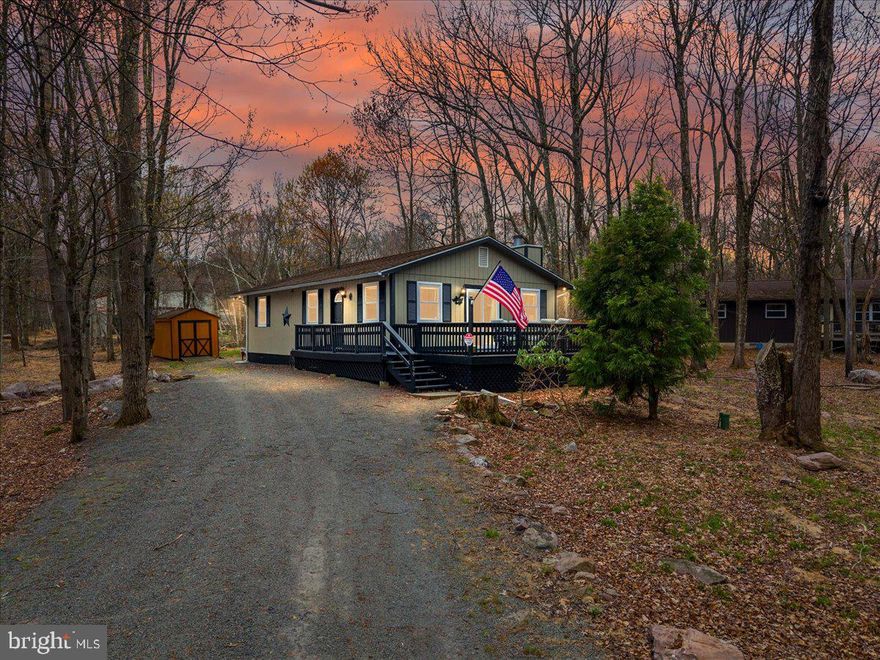 Just in time for the warmer months, this turnkey property in Towamensing Trails is ready for you to make lasting memories!  Many recent upgrades have been done, adding modern touches to the charming mountain aestetic.  The private driveway leads you to a nicely shaded lot, and you'll immediately notice the curb appeal with the freshly painted exterior.  A large deck welcomes you, and provides a fantastic place to relax with family & friends.  Step inside and fall in love with the knotty pine walls and stone fireplace.  The kitchen is well appointed with oak cabinetry and new appliances.  Three freshly painted bedrooms with brand new ceiling fans, and an updated full bathroom are down the hall. The bathroom features a new floor, modern vanity, and new toilet.  Outside, enjoy the freshly sanded & painted decks, the private wooded lot, and the charming shed with electricity for your storage and hobby needs.
Towamensing Trails is one of the most sought-after communities, for its location and amenities.  Lake & Beach access, boat launches, pool, playground, clubhouse, basketball courts, tennis & pickleball courts...there is something for everyone whether you're into relaxation, socializing, or adventure.  Close proximity to the ski mountains for a great winter getaway.  The best part? This property is truly turnkey, as all the furniture, appliances, kitchenware, decor, and linens are included! Schedule an appointment today, and you could be enjoying this lifestyle by Memorial Day!