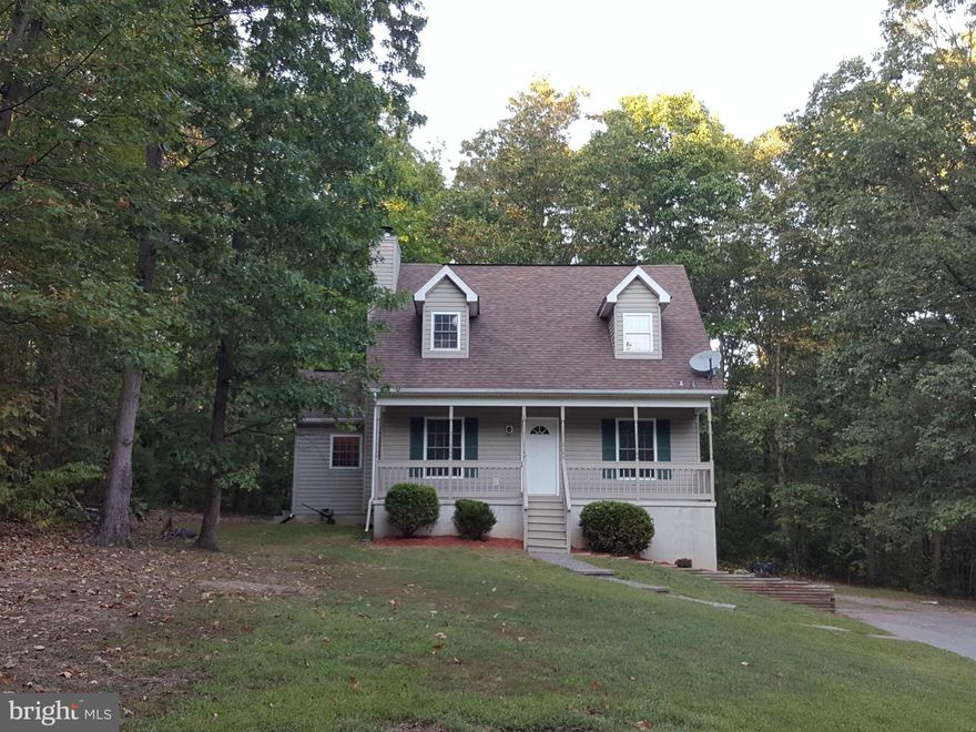 Beautiful house on 2 acres in very private setting, nice neighborhood.  Freshly painted, new carpeting.  This home features ceramic tile in the kitchen and baths, Master Suite has jetted tub and great scenery from every window.  You will love the covered front porch the width of the home and plenty of parking.  Full unfinished basement with walkout.  Must see!