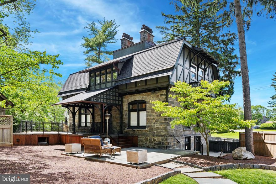 Historic Elegance Meets Modern Luxury in the Heart of Wynnewood

Welcome to 1202 W Wynnewood Road, a remarkable residence that seamlessly blends historic grandeur with refined modern upgrades. This one-of-a-kind home is part of the former Ballytore Estate, once owned by Isaac Clothier, co-founder of the legendary Strawbridge & Clothier department stores—a rare and storied piece of Main Line history.
Originally built by Henry Morris in the late 1800s, the estate was inspired by architectural themes he admired during his European travels. The result is a home rich with character, timeless design, and enduring craftsmanship.

Enter through original double doors and under the Henry Morris engraved stone header, and you're greeted with a generous foyer directing you multiple living spaces and to the heart of the home, the open-concept kitchen which is beautifully updated and perfect for everything from dinner parties to quiet evenings at home. A spacious island with stone countertop makes a quick meal easy, or convenient staging for a party. The dining room and living room are both served by beautiful fireplaces with detailed mantles and lots of natural light. Upstairs, you’ll find three generously sized bedrooms, with a luxurious primary suite, featuring a fireplace, beamed ceilings, custom closets and a tranquil, spa-like ambiance in the primary bath—offering the perfect private retreat. Easy full-stair access to the attic makes for convenient storage.

Throughout the residence, rich hardwood floors, classic herringbone brick flooring, and six original fireplaces add layers of elegance and warmth. Original architectural details have been meticulously restored, including the marble flooring in the lower-level TV room, providing a unique and timeless touch. The home has been designed for serious entertaining inside and out with high ceilings, an easy flow, and lots of details to oooh and ahhh about. 

Modern comforts include dual-zoned HVAC, smart lighting, integrated audio and video systems, and a dedicated EV charger, as well as a convenient and private home office space. Outdoor living is equally inviting, with three private outdoor spaces: a front terrace, a peaceful side garden, and a rear deck with a motorized awning for shade and comfort. New landscaping and hardscaping surround the home in natural beauty and low-maintenance design. A spacious unfinished cold storage room provides exciting potential—perfect for a wine cellar, fitness area, or creative studio or extra storage. 

Located within easy walking distance of Whole Foods, favorite restaurants, Starbucks, shopping, and public transportation, as well as a new luxury fitness club opening in 2026, this home delivers the rare combination of historic significance, modern luxury, and unbeatable convenience. 

1202 W Wynnewood Road is more than a home—it’s a once-in-a-generation opportunity to own a piece of Main Line history, thoughtfully updated for today’s lifestyle.