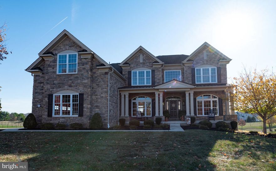 Welcome to 125 Bennington Road in Phoenixville, a stunning residence that seamlessly blends luxury and functionality, nestled against serene open space with walking trails in a charming neighborhood. As you enter, you’ll be greeted by a breathtaking two-story foyer and living room featuring a cozy gas fireplace, highlighting exceptional craftsmanship and elegant wainscoting throughout. The open-concept design showcases a remarkable kitchen with granite countertops, perfect for entertaining family and friends. The dining room includes a delightful coffee bar and a charming pantry, along with a separate laundry room adjacent to the three-car garage and a home office next to the powder room. Upstairs, you’ll find four spacious bedrooms, including one en-suite and a luxurious primary suite that boasts a cozy sitting area, a walk-in shower, a soaking tub, and three walk-in closets. The fully finished, walk-out basement is a true highlight, offering an entertaining kitchen, an inviting fireplace, and a game room—perfect for leisure and gatherings. With a whole house generator and high-end finishes throughout, this lovely home has everything you could desire!