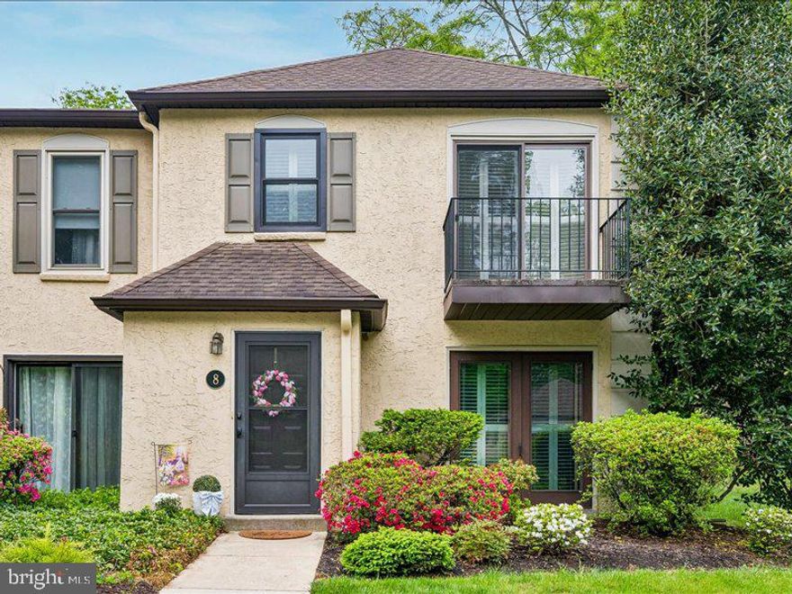 The best of Radnor Township can be found in this beautifully updated  two-story end unit townhome located in the highly sought-after Millridge community in Bryn Mawr; This 2-bedroom, 2-bath residence offers an exceptional blend of comfort, style, and low-maintenance living, with significant investment in high-quality renovations throughout. Step inside to a bright, inviting floor plan featuring a spacious living and dining area with new engineered hardwood flooring, a stunning gas fireplace, and elegant plantation shutters. Sliding glass doors open to a charming flagstone patio—perfect for relaxing or entertaining. The fully renovated kitchen (2024) is a true highlight, showcasing Corian countertops, updated cabinetry, and modern finishes. Both bathrooms have been tastefully renovated (2023) with clean, timeless design. The primary suite offers a peaceful retreat with a private bath, while the second bedroom provides flexibility for guests, a home office, or additional living space. An attic space provides ample storage, adding to the home’s everyday convenience. Recent upgrades include new windows, new sliding doors, and a new heater (2023), offering added comfort and energy efficiency. Residents of Millridge enjoy access to the beautifully appointed Manor House, available for social events, along with guest suites for overnight visitors. The community also features a heated swimming pool and a fully equipped pool house, offering resort-style amenities right at your doorstep. Enjoy the beautifully maintained grounds of Millridge along with its prime Main Line location—just minutes to shopping, dining, and major roadways. A rare opportunity to own a thoughtfully updated home in one of Bryn Mawr’s most desirable communities.