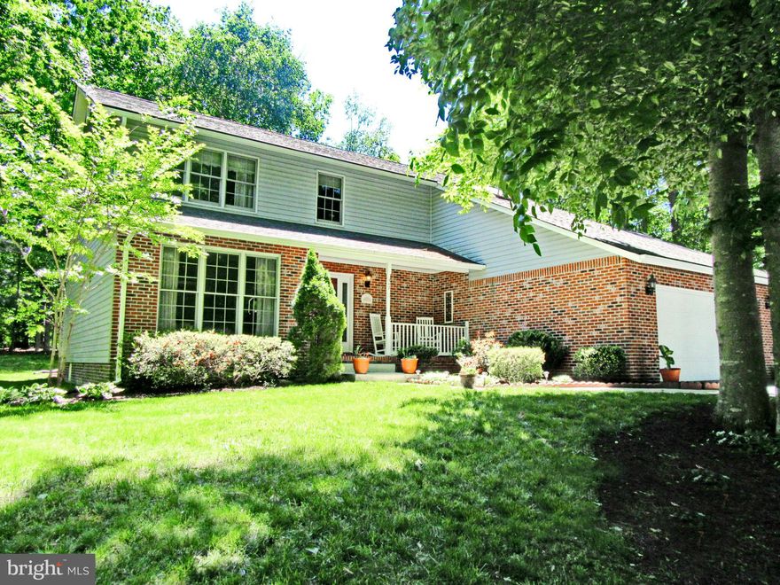 Pack your bags! 4 BR home sits on a meticulously landscaped yard that backs to woods. Updated country kit overlooking family room with fireplace and doors to screened in porch...perfect for relaxing or entertaining! Master Ste w/lg WIC & Mstr Bath w/soak tub, sep shower & dual sinks. Laundry room on kitchen level. 2 car garage. Close to shopping, dining and more! This one won't last long!