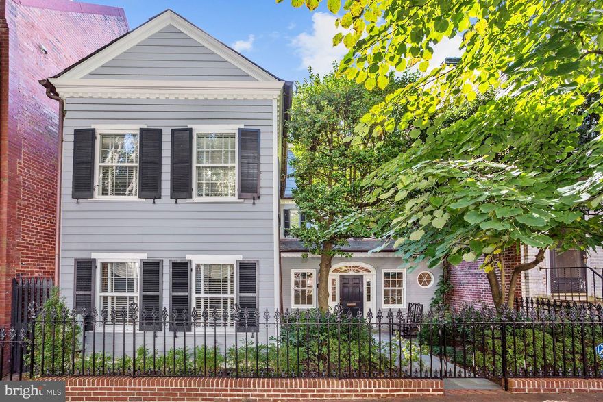 GREAT NEW PRICE! THREE CAR GARAGE! Ideally located in the very heart of the Village of Historic Georgetown w/ a walking score of 94! Main level features generous Entry Hall, sunlit Living Room with Garden and Terrace Access, gourmet chef's Kitchen with custom maple cabinetry, Family Room adjacent to the kitchen with French doors leading to Terrace, formal Dining Room, Butler s Pantry, laundry center and Powder Room. The second level includes a deluxe Master Bedroom suite with walk-in closet and luxurious bathroom with soaking tub and two additional Bedroom Suites while the third level offers a Sitting Room with Virginia views and a large fourth Bedroom with wall of closets. The lower level is fully finished and includes an office with wall of built-ins. This beautiful home sits on a large private lot with an expansive Flagstone Terrace and professionally landscaped yard and gardens. A THREE CAR GARAGE with automatic doors, pedestrian door and additional attic storage complete this magnificent home!