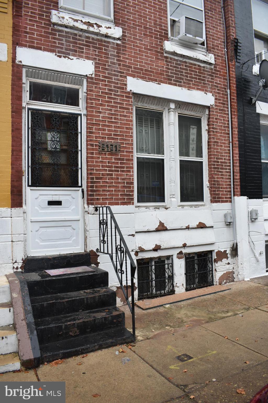 Consider exploring this huge three story interior row home in the 19121 section of Philadelphia. This classic brick straight thru home offers quite square footage of nearly 1,400-1,500 square feet with its dramatically high ceilings, a dual living room and dining room combination layout, and a kitchen large enough for adding your own customization and room for a table for eat-in. The kitchen has recently been updated with newer countertops and cabinetry. Right from the kitchen you have access to an enclosed sun room with direct access to the private fenced in rear yard, which is ready for your evenings and morning relaxation as well as entertaining your friends and family. You will discover three well-sized bedrooms upstairs on the second floor, including the front facing larger bedroom, which does have jack and Jill access to the middle bedroom. One full bathroom, which has been updated with newer flooring, is located on this second floor. Continue upstairs to the third floor to discover an additional two bedrooms! The unfinished basement is very large and runs a good length of the house. Upgrades include a newer hot water tank, newer heating system, and an updated electrical panel. This property is surrounded by renovated properties, adding instant value to the immediate neighborhood. A stone throw away is neighborhoods Brewerytown, Art Museum District, as well as a short commute to all the sights and sounds of Center City! Consider adding seeing 2131 N 28th Street to your list of properties today.
