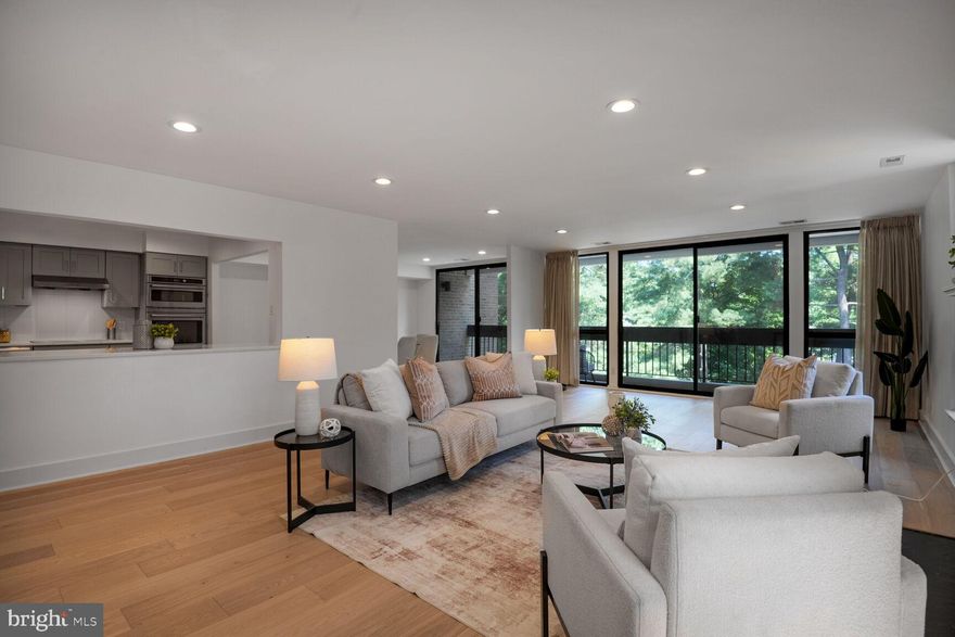 This recently renovated corner unit is move-in ready and offers a desirable blend of luxury and convenience. The home has been renovated with modern features and has an open floor plan with high ceilings, large windows, and recessed lights throughout.  

The living and dining rooms feature sliding doors that open to the large private balcony. The generously sized kitchen has tremendous storage space, beautiful white quartz countertops and high-end appliances. The primary suite has a beautifully renovated bathroom with dual vanity and large walk-in closet. The secondary bedroom suite has a nice size closet and lovely, renovated, full bath with quartz countertop and chrome fixtures. Down the hall, you'll find the third bedroom/den/office. There is also an entry foyer and coat closet, powder room, a  mechanical closet with storage and washer/dryer.

Sumner Village features 24-hour security with a gatehouse, a pool, tennis and pickleball courts, a fitness center, a community room, and manicured landscaping and walking paths. Unreserved parking is included. Conveniently located within walking distance to the Shops at Sumner Place and multiple parks.