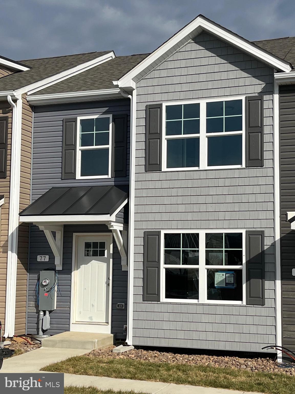 Under Construction. 3 bedroom, 2.5 bath 2-Story town homes featuring spacious room sizes, luxury vinyl plank flooring in main living areas, Bump out in main level family room, and kitchen with island, granite countertops, and pantry. The Primary Bedroom has walk in closet and full bath with double vanity and tile shower w/ glass door. All homes come with natural gas heating system and brick accents on front. 10x12 Rear deck included and builder pays 3% closing assistance. Photos are similar construction