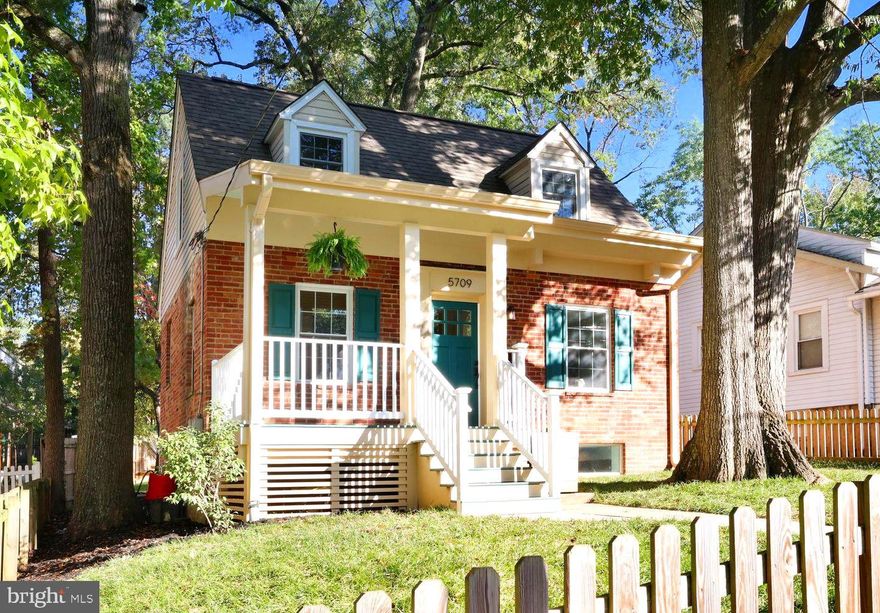 Welcome to 5709 40th Place, a delightful 3 bed 2 bath Cape Cod located on a quiet tree-lined street in walkable Hyattsville. As you approach, you’re greeted by a generous front porch, perfect for relaxing at any time of day. Upon entering, you’ll notice a spacious living room with recessed lighting and plenty of natural light. The dining room opens seamlessly to the updated kitchen, with modern light fixtures, quartz countertops, upgraded cabinets, and stainless steel appliances. The original hardwood floors have been beautifully refinished throughout the home and give the period charm you come to expect from our area’s 1930s Cape Cods. Upstairs, two large bedrooms await, your oasis from the workaday world. The gabled windows provide extra space and brightness, and the original hardware on the doors provides an extra touch of class. A fully remodeled bathroom rounds out the second floor. Downstairs, you’ll find a sizable third bedroom which can also be used as an office, recreation space, or guest room, as well as another fully remodeled bathroom. This home is perfect for entertaining and outdoor living! The covered rear porch can be accessed from both the kitchen and living room. The spacious, fully fenced yard is your long-awaited oasis for gardening, parties, or letting the dogs roam.The yard is complete with a custom-built shed, large enough to be converted into an office or guest space. Finally, this home is within walking distance of everything you love about Hyattsville - Vigilante, the Arts District, Driskell Park, Route 1 Shopping and Restaurants, and more. Also, conveniently walkable to the Metro for commuters. Don’t miss your chance to live in this wonderful neighborhood!