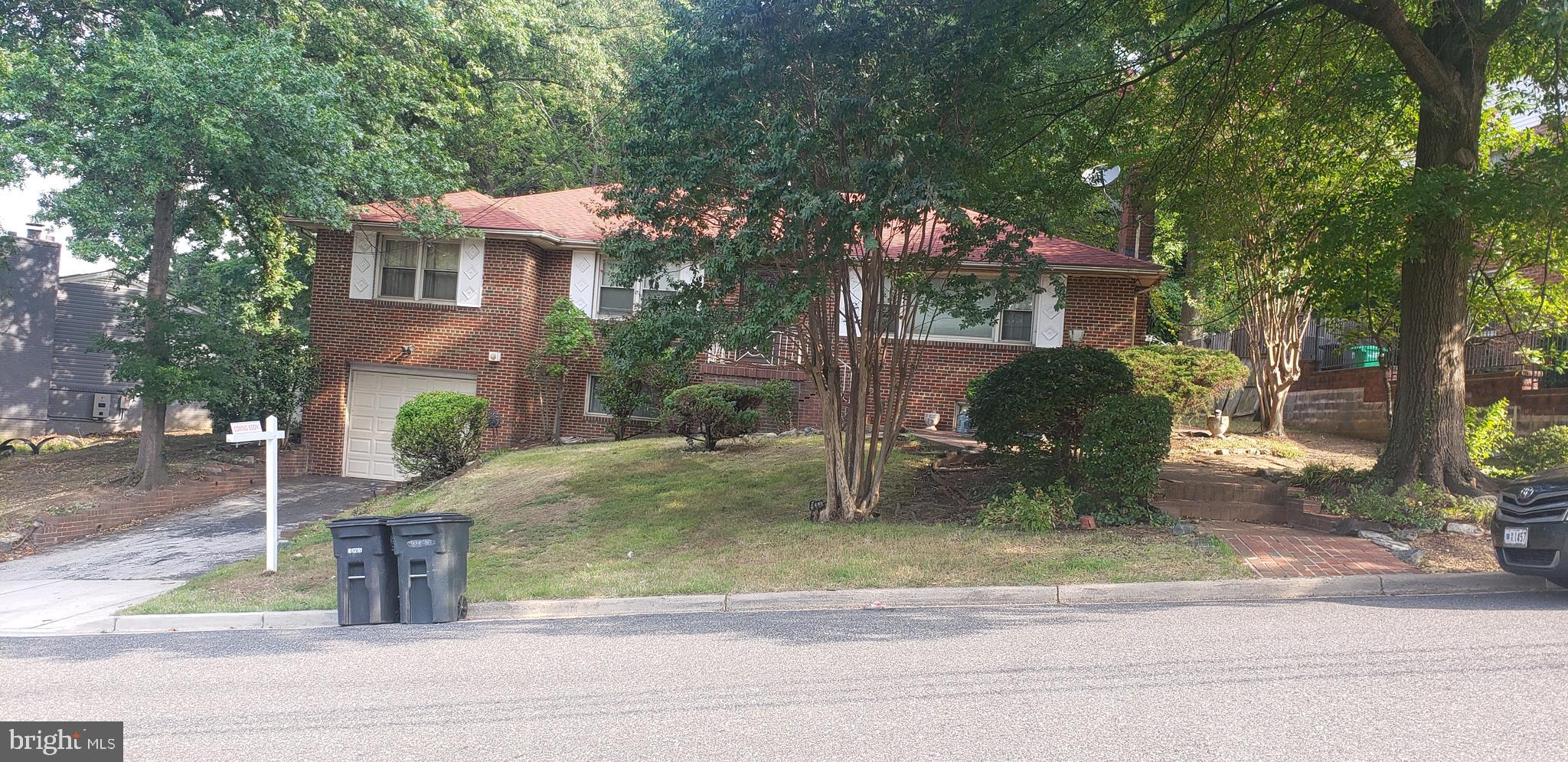 Seller is offering $3K bonus to Selling Agent. Seller is highly motivated. .Charming 2-level, all brick home with two (2) fully renovated and upgraded baths. Entry boasts marble flooring. Living and Dining Rooms feature original hardwood floors with a stone fireplace that adds warmth and character to every gathering. Three ample sized bedrooms are perfect for family and guests . In the back yard, you'll find a basketball court and a shed. There is also space to play, entertain or just rest and relax among the mature landscaping The large basement has (1) full bath and a private office area. Additionally, the spacious basement family room has a large fireplace with a wood burning stove. There's also an added enclosed back porch with windows on 3 sides, which has heat and air conditioning, thereby making it habitable during all seasons. This home is a blend of traditional charm and timeless appeal. Don't miss your chance to check out this beauty. Schedule your showing today.