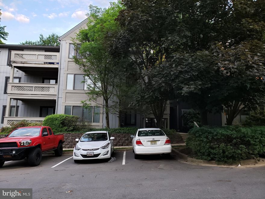 Sunroom with fan shaped window, deck, assigned parking. Remodeled.Light and airy garden condo.