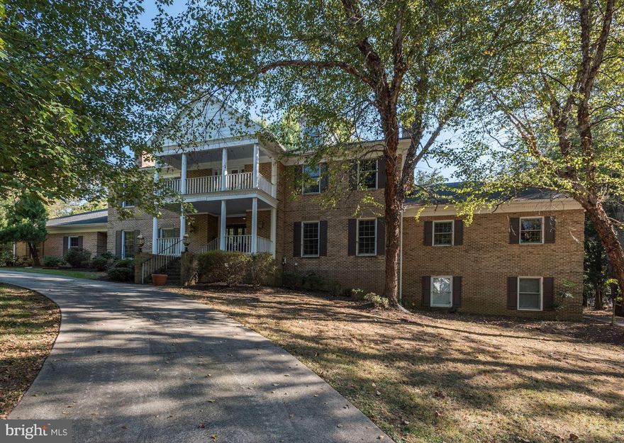 Expansive Estate Home on over 3 beautiful acres!  Stunning grand entrance with double circular staircase.  Oversized rooms with high ceilings and 5 fireplaces.  With over 9000 total finished square feet, this home is great for entertaining and features a private in law suite.