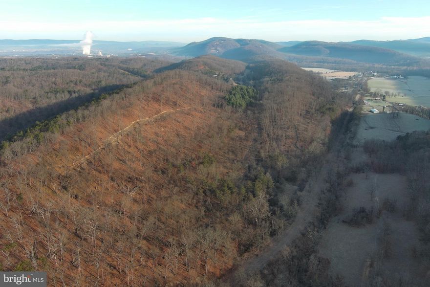 RARE,RARE,RARE! 68 ACRES OF UNRESTRICTED LAND LOCATED IN THE HIGHLY DESIRABLE SHORT GAP AREA.  SITUATED AT THE INTERSECTION OF 2 COUNTY PAVED ROADS, THIS LARGE PARCEL IS CONVENIENTLY LOCATED JUST 3.5 MILES FROM RT. 28 - WHETHER COMING FROM FT. ASHBY BY WAY OF PATTERSON CREEK VILLAGE PIKE OR BY WAY OF OLD FURNACE RD. FROM RT. 28 NORTH OF SHORT GAP.  YES, IT WAS RECENTLY TIMBERED, SO IT IS TIME TO LOOK INTO THE FUTURE, USE SOME IMAGINATION, AND REALIZE THE BENEFITS THAT THIS CAN PROVIDE.  THE NEW LOGGING ROADS PROVIDE EASE OF ACCESS TO ALL AREAS OF THE PROPERTY, NOT TO MENTION THE NEW WILDLIFE HABITAT THAT HAS BEEN CREATED.  THE CURRENT OWNER ALSO TOOK CARE TO LEAVE LARGE STANDING TREES ON THE RIDGE TOP THAT IS MOST CONDUCIVE FOR BUILDING A HOME.  FEATURES OF THE PROPERTY INCLUDE A HIGH RIDGE THAT PROVIDES WONDERFUL MOUNTAIN VIEWS TO THE SOUTH AND EAST, A SHALLOW HOLLOW IN THE MIDDLE OF THE PROPERTY THAT WOULD BE A PERFECT SPOT FOR A LARGE POND,  A FLAT RIDGE TOP WITH EASY ACCESS, AS WELL AS  PUBLIC WATER AND SEWER AVAILABILITY.  WHETHER YOU ARE LOOKING FOR A PLACE TO BUILD YOUR DREAM HOME WITH PLENTY OF GROUND TO USE AS YOU CHOOSE, OR A PLACE TO EXPERIENCE PEACE, QUITE, AND RECREATION,  THIS ONE WILL NOT DISAPPOINT.  TRACTS OF THIS SIZE AND TOPOGRAPHY IN THIS AREA DON'T BECOME AVAILABLE VERY OFTEN.  DON'T HESITATE OR IT MAY BE GONE.  TAKE THE STEPS TODAY TO HAVE WHAT YOU HAVE ALWAYS WANTED!