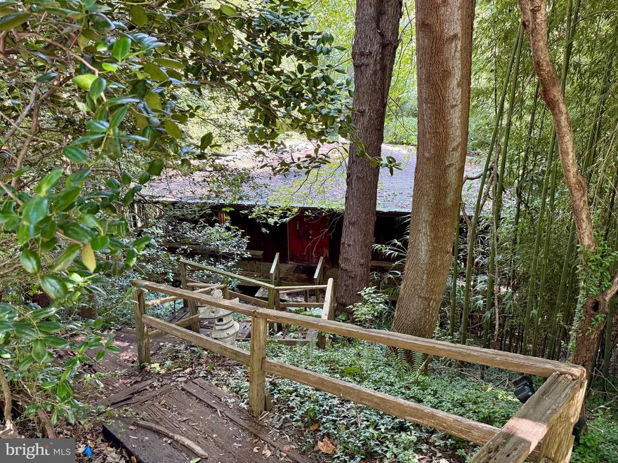 Pending Release.  Nestled in the tranquility of Scotts Run, just outside the beltway,  on a half-acre sanctuary, this unique one-room structure—designed in the tradition of a Japanese tea house—offers a rare opportunity in McLean real estate***Built in 1973, this modest space was conceived as a serene retreat with a harmonious connection with nature.  Perched on a half-acre sloped lot that backs to Scotts Run., the setting is intimate, perfect for a close-in escape.***The structure needs a full restoration or start anew building a contemporary retreat or expand for a larger residence. ***Whether embraced as a preservation project or reborn into something entirely new, it invites imagination and vision in a wonderful location.