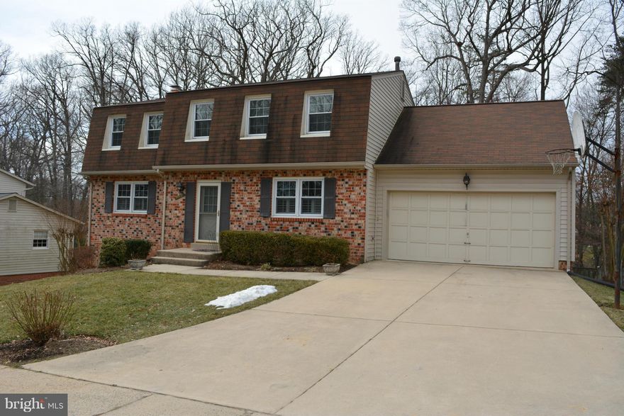 Enjoy the extra room in this updated BARON model in desirable Kings Park West.  Walk to ROBINSON/Oak View/GMU.  Beautiful hardwood throughout 1st and 2nd levels.  Renovated kitchen w/granite and upgraded cabinets and appliances. Updated bathrooms/2 car garage/fireplace. Fin. basement w full bath & 5th bedroom/office.  Large Master BR.   Nice deck overlooks fenced yard/backs to trees. Home Warranty