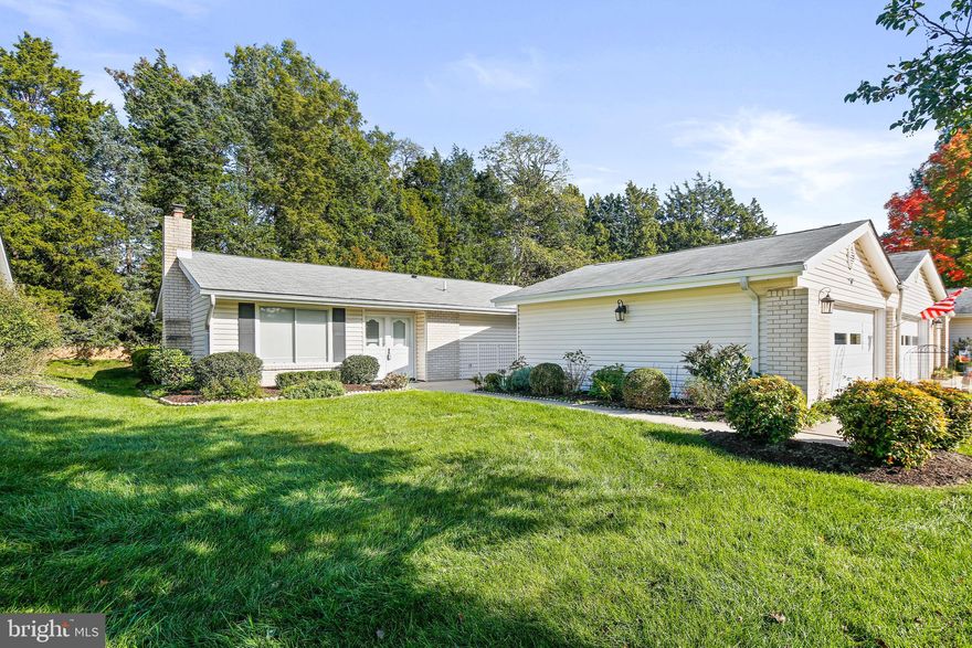 Sought after Leisure World single-level living at its best! This 3 bedroom, 2 bath semi-detached rancher is move-in ready. Head past the landscaped front yard and into the living room that's filled with natural light from the slider window. The dining room adjoins the updated kitchen making it easy to entertain dinner guests. You'll love the stylish and functional kitchen with stainless steel appliances, quartz counters, subway tile backsplash, and the convenient pass-through to the sunroom. The sunroom is the best spot for sipping your morning coffee or enjoying a good book while listening to the birds.

Just down the hall are three bedrooms, two of which have custom cork flooring and the third bedroom has brand new carpeting.   The Florida room carpet is also brand new.   The hall bath has wainscoting and updated flooring. The primary bedroom has an ensuite full bath with grab bars and an oversized closet. The laundry center is tucked discreetly in the hall along with the 2-year-old water heater and HVAC unit.

In the warmer months, enjoy the gated patio space between the home and the ample 2-car garage, waving to neighbors while enjoying an afternoon beverage. The home backs to a serene, recently landscaped backyard. Take part in all the amenities that Leisure World has to offer by staying active on the golf course, swimming in the indoor and outdoor pools, working out in the fitness center, strolling on the paved paths, and forging new friendships in the community center and clubhouse. Welcome home!