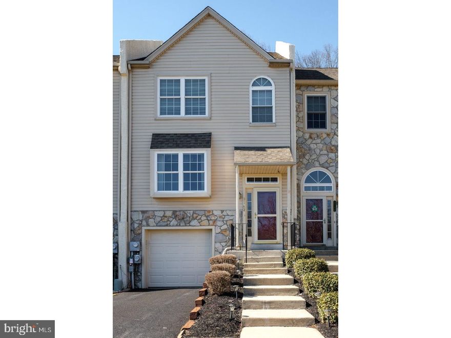 Convenience, energy savings and a beautifully updated townhome with a garage awaits the future owner who wants to be able to just "move in!"  This spacious home has a well appointed kitchen that features beautiful granite countertops and tile floor, complete with a butlers" pantry with terrific storage. The eat-in kitchen opens to the sunny family room, warmed in winter by the gas fireplace with sliders to the oversized Trek deck.  An automatic retractable awning makes this space like a three season room overlooking a lovely so quiet backyard! Upstairs are the double doors that open on to the large Master with great closet space and a luxurious new bath with double vanities and gorgeous, custom tiled shower. The additional two bedrooms and full bath complete the second floor.  The lower level opens from the lower foyer or from the attached garage.  It has a room currently used as a reception area attached to the office/study. There is a full bath and a laundry room on this level as well as additional storage.  The airport, shopping and restaurants off 202 as well as convenience to both Philadelphia and Wilmington make this home an attractive alternative to a long commute!