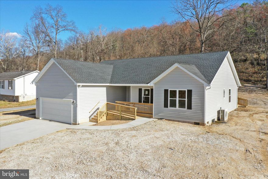 This new build is move in ready and features custom enhancements!! Become the proud owner of a home with thoughtful design in the town of Capon Bridge, WV that is known for it's homegrown businesses, deep rooted history, and country charm. This 3 bd, 2 bath home with a concrete driveway and an attached garage (16 ft door) showcases quality craftsmanship. This home boasts of hardwood floors and granite countertops all with premium detail.  Enjoy the 43 ft screened in porch with ceiling fans.  A concrete walkway and handicap ramp make for easy access.  No HOA here! Live on a paved street.  This home has public water/sewer.  The town rests on the banks of the beautiful Cacapon River and is known as the “Gateway to the Mountains”.   Enjoy a stroll to downtown shops and local attractions.  Don't wait! Schedule you tour today and see for yourself!!