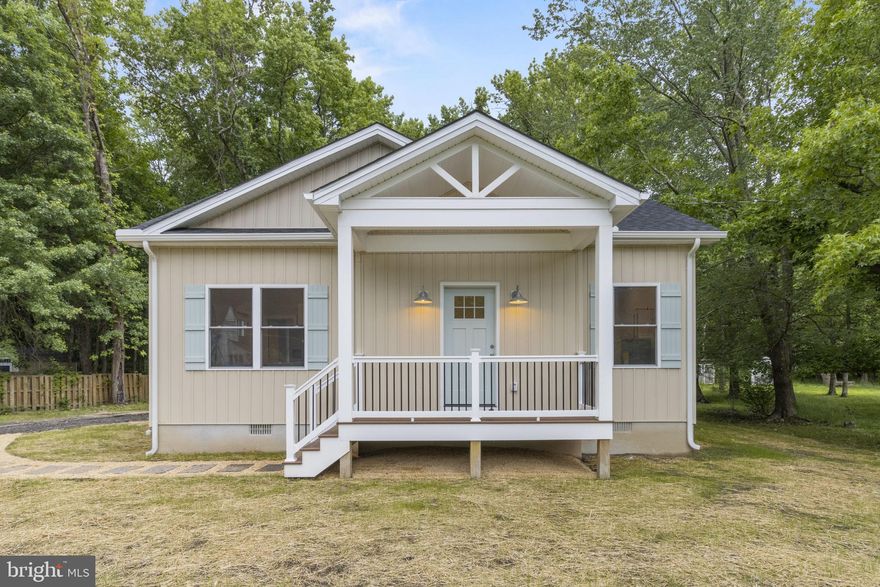 Stunning NEW CONSTRUCTION cottage in Shady Side is ready for its first owner! Wide open floorplan and cathedral ceilings make this home feel spacious, light, and airy. Luxury vinyl plank floors throughout. Primary bedroom offers a private ensuite bathroom, and there is a 2nd full bathroom outside of the 2nd bedroom. There are two side doors: one takes you to the driveway, and there is a slider on the other side of the house with space for a future deck or patio.  The lot is almost 2/3 of an acre! Where else can you get a BRAND NEW home for $350k?! Close to marinas, boat ramps and everything that life near the water has to offer. Schedule your tour today!