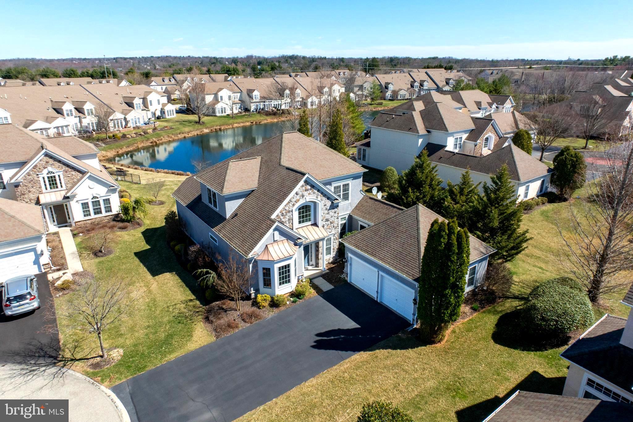 Welcome to your new home! This stunning 3-bedroom, 2.5-bath, 2-car garage single-family home features a first-floor main suite within the Reserve at Gwynedd, an exclusive gated community for residents aged 55 and over, along with access to recreational facilities. This fabulous and airy home is nestled in a peaceful cul-de-sac and features a backyard with a tranquil pond view. The entrance that covered the porch welcomes you into this elegant home. Enter the two-story foyer with gorgeous hardwood floorings that gleam under the light and open to the den/office, dining room, kitchen, adjoining breakfast room, sitting/sun room, and powder room, door to the laundry room and 2 car garage, which flow seamlessly together, creating a warm and inviting atmosphere. 1st floor features a bright primary bedroom that boasts a tray ceiling, a tiled full bath with tub and shower, a large walk-in closet, and an additional closet. Den/office with elegant chair rails and wainscoting, accentuated by cathedral ceiling with recessed lighting. The dining room has wood floors, chair rails, wainscoting, and a tray ceiling with recessed lights. Two-story family room featuring a fireplace, ample windows for natural light, hardwood floors, and a vaulted ceiling with recessed lighting. The kitchen features a beautiful granite countertop, a double bowl under-mount sink, 42" cherry cabinets, a pantry, a butler's pantry, and a door leading to the spacious laundry room and two-car garage. Adjacent is a bright breakfast room with a gorgeous sun-filled sitting/sunroom that offers a beautiful view of the pond. The second floor boasts a stunning wooden staircase with open railings that provide a view of the family room and foyer below. An expansive open loft offers versatile space perfect for art, music, or office activities. Completing this level are two generously sized bedrooms, accompanied by a full bathroom conveniently located in the hallway for guests. The Reserve at Gwynedd offers residents a lifestyle enriched by access to various amenities, including clubhouses with both indoor and outdoor pools, card and billiard rooms, a fitness, and a library, among others. This community fosters a vibrant atmosphere where elegant living meets a dynamic communal life, showcasing that this is more than just a place to live—it's an opportunity for a fulfilling lifestyle. Proximity to hospitals, restaurants, golf courses, parks, supermarkets, and shops, with easy access to major highways. Easy to Show!