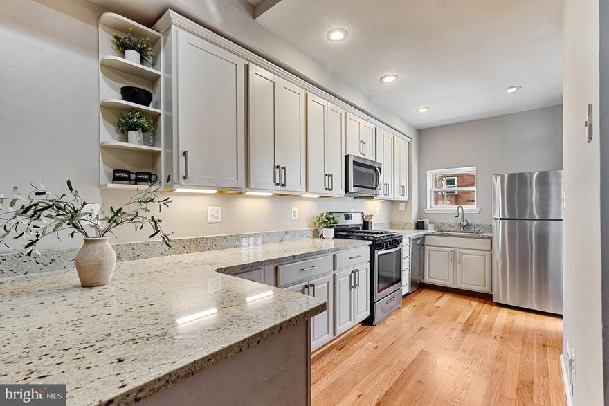 Gigantic Federal Hill Townhome with Skyline & Stadium Views

Welcome to this truly impressive four-level townhome located in the heart of Federal Hill, offering one of the highest, most jaw-dropping panoramic views of the Baltimore city skyline and stadiums from a spectacular rooftop deck.

The home features original hardwood flooring throughout, beautifully preserved historic floors on the upper levels, complemented by brand-new hardwood flooring on the main level, seamlessly blending classic charm with modern updates.

The main level is designed for both everyday living and entertaining, featuring a spacious living room, dining area, and newly renovated kitchen. The kitchen is a showstopper with white granite countertops, stainless steel appliances, exposed brick accents, and a beautiful brick fireplace that adds warmth and character. Just off the kitchen, step out onto a private deck that leads down to a rear patio, perfect for outdoor dining or relaxing.

The second level offers two generously sized bedrooms and a full bathroom accessed from the hallway, providing comfortable accommodations for guests or family.

On the third level, you’ll find a huge primary bedroom, a full bathroom off the hall, and a bonus office or flex space that opens directly onto the rooftop deck—the ultimate retreat with breathtaking, unobstructed views that make this home truly unforgettable.

The brand-new finished basement expands the living space even further, featuring a large storage/utility room and a separate bedroom or den with its own full bathroom, ideal for guests, a home gym, or additional living space.

This exceptional Federal Hill townhome combines historic character, modern finishes, expansive living space, and unmatched views—a rare opportunity in one of Baltimore’s most sought-after neighborhoods.