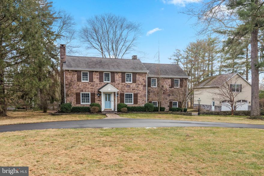 A Solebury Township Masterpiece: Where Historic Charm Meets Modern Living
Discover this enchanting 1943 farmhouse, lovingly restored and thoughtfully enhanced on over 2 acres in sought-after Solebury Township. Set on a desirable corner lot, this 5-bedroom, 2.5-bath residence seamlessly blends timeless character with contemporary conveniences.
The home's striking Bucks County redstone exterior welcomes you into spacious interiors featuring gleaming hardwood floors throughout the bedrooms, living room, dining room, and powder room. The award-winning kitchen is a showstopper, boasting one-of-a-kind Italian porcelain tiles, Bosch appliances, an electric fireplace, inviting banquette seating, and whimsical touches like a custom tiled dog wash and hay-trolley 'chandelier'. Custom window treatments add polish throughout.
Relax in the stunning sunroom with vaulted ceilings, tiled floors, automated blinds, and sliding doors that open to an expansive composite deck—perfect for peaceful birdwatching. Additional features include a gas fireplace and Generac generator for peace of mind.
The extraordinary grounds are a nature lover's paradise: a certified National Wildlife Federation wildlife habitat with pollinator-friendly wildflower gardens, a separately fenced raised-bed vegetable garden, and a private, fenced backyard ideal for children and pets. The crown jewel is the 30,000-gallon hand-packed concrete Sylvan pool, surrounded by elegant hardscaping, a covered pergola, firepit, and lush landscaping—your personal resort for entertaining and family gatherings.
A substantial two-story pole barn provides two garage bays and workshop space below, while the vaulted second floor with fan, carpet, and rough-hewn board walls offers endless possibilities: recreation room, art studio, yoga space, office, or storage.
With a storied past as a parsonage, artists' retreat (home to legendary musicians and children's book illustrators), and 40-year residence of Solebury National Bank's former President, this property offers not just a home, but a legacy.