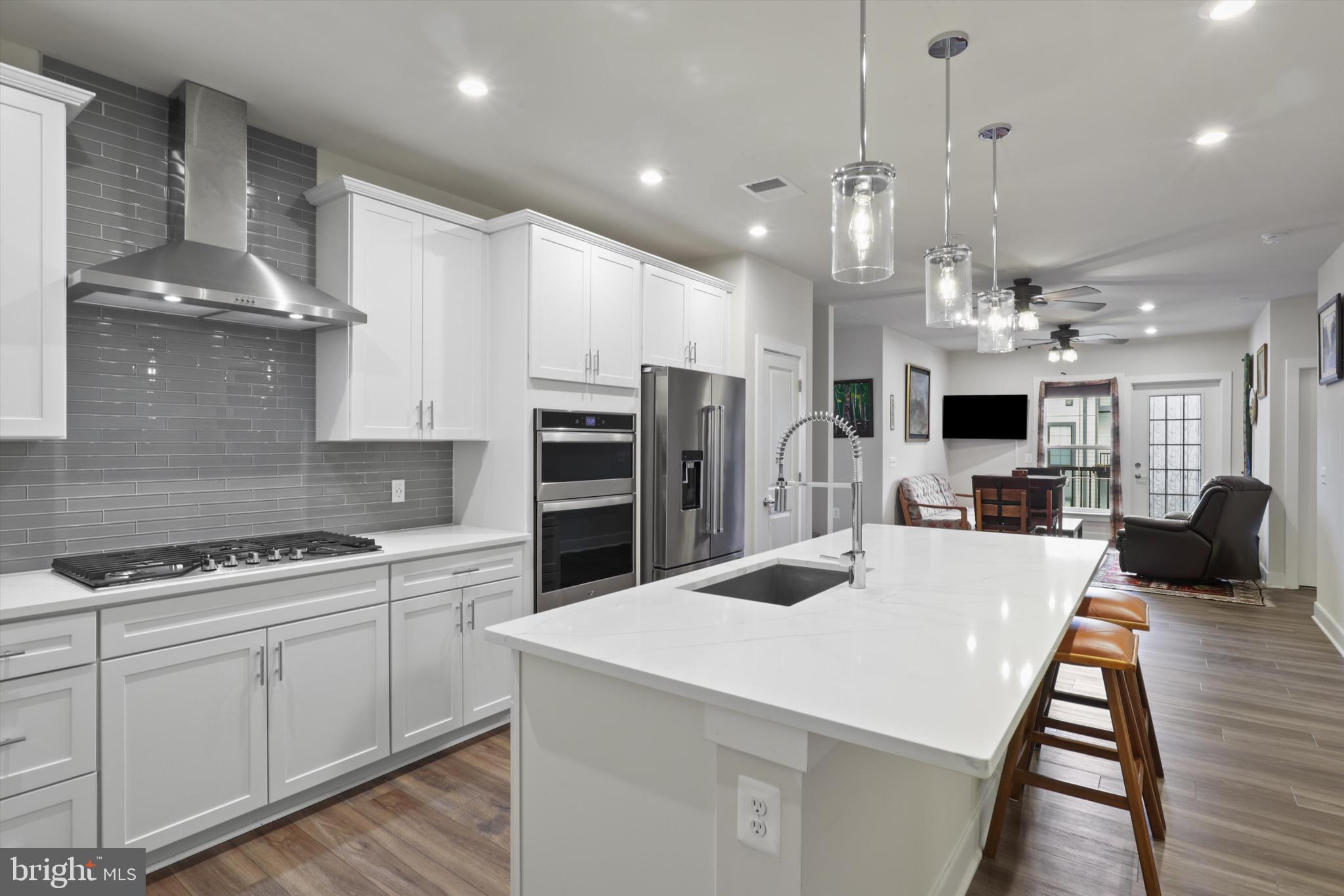 Owner is eager to start retired life on the beach! Price Adjustment!
Check out this gem located in the gated community of The Flats at National Harbor. This coveted top-floor unit (with partial views of the Harbor’s fireworks!) features 2 bedrooms, 2 bathrooms, and a versatile den that shows like new. Only 2 years young, this home is brimming with premium upgrades such as an inline hot water softener on the tankless water heater, pedestal Whirlpool washer and dryer, ceiling fans in 5 areas, and custom, cordless blackout blinds throughout. As you enter, an open and inviting space greets you. The kitchen boasts gleaming white cabinetry, quartz countertops, a tile backsplash, a 5-burner stove, a wall-mounted oven, and a motion-sensing kitchen faucet. Imagine preparing your favorite dishes in this well-appointed space, with the living room providing the perfect backdrop for engaging with friends and family. Next to the kitchen, there's a large den that can be used as an office, playroom, extra living space, or fitness room. With French doors and beautiful privacy-enhanced glass, you can transform this space as far as your imagination takes you. The primary bedroom features a large ensuite bathroom and a spacious walk-in closet. The second bedroom offers ample closet space and is conveniently situated next to a full bathroom in the hallway. A spacious laundry room houses upgraded front-load washer and dryer units. This home includes one assigned garage parking space with bike rack. Residents can also enjoy beautifully landscaped common areas and controlled entry access for guests and one assigned parking space in the covered garage! Residents benefit from discounts at restaurants, shopping, dining, and parking at National Harbor as well as easy access to bike and walking trails. The community is conveniently close to Andrews, Bolling, the Pentagon, and Old Town Alexandria, with easy access to 495/95, 295 Just minutes from downtown DC. The MGM and Tangier outlets are less than 5 minutes away.