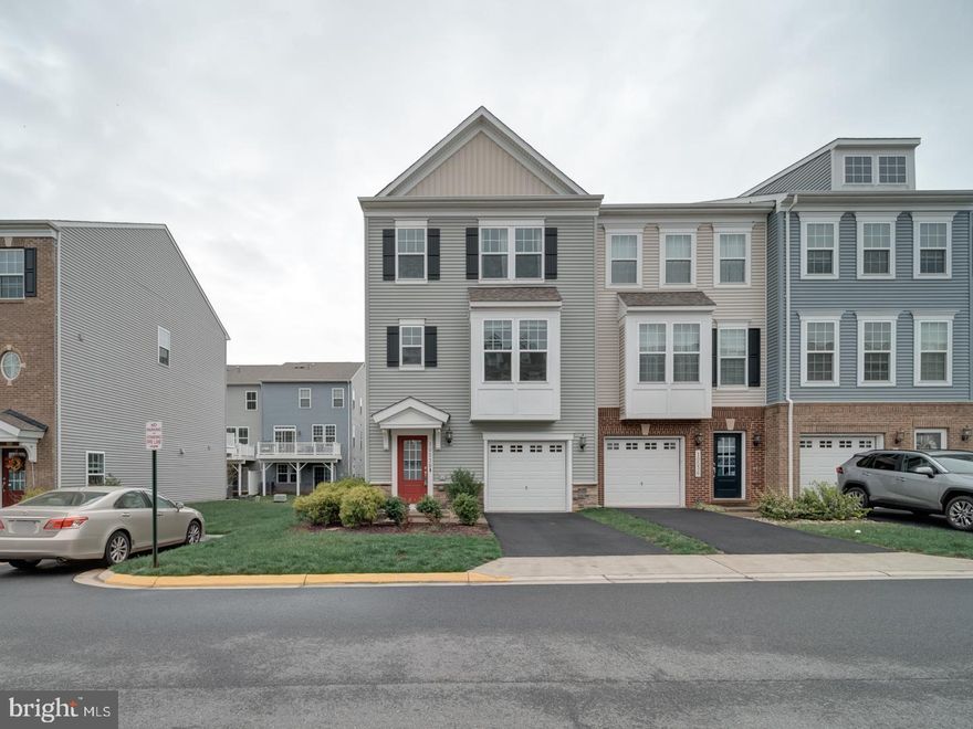 End Unit Townhome with 1 car garage with EV Charger , 3 bed 3 full and 1/2 baths with upgraded Kitchen with large center island , Granite Countertops and stainless appliances  42 inch cabinets, manufactured wood,  deck off kitchen level and walk out basement , laundry on upper level , blinds on all windows, family room /rec room in basement . basement can be a 4th bedroom as has a closet and bath  and ingress egress.  Has an FHA loan on it at 6.625% that is assumable with less then $30K needed by buyer .   furniture in primary bedroom can convey