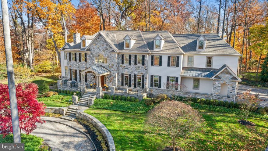 1000 Radcliff Lane Was Enhanced In 2020 With A Major Replacement Of The Stucco Exterior With HARDIE PLANK And More Than A Total of 20 New Windows And Doors. This Exquisite Manor Home In Lower Gwynedd Is Perfectly Situated At The End Of A Lane Of Custom Homes In The Much Sought-After Community of Radcliff Manor.  This Stunning Estate Home Incorporates Warmth And Charm With A Spectacular Floor Plan.  Combining Elegance With Ease Of Living, Every Room Has The Finest Craftmanship And Attention To Detail.  The Scenic Drive Leads To A Cobble Stone Circular Driveway And Elevated Front Staircase With Grand Terrace Creating An Impressive Front Entry Setting.  Enter The Home Through The Elegant Two-Story Marble Floored Foyer Opening To A Majestic Turned Staircase And Balcony. The Center Hall Foyer Leads On The Left To The Peaceful And Gracious Formal Living Room And On The Right To The Large Dining Room With Tray Ceiling, French Doors And Gorgeous Millwork Ideal For Family Holiday Dinners And Impressive Entertaining.  The Large Family Room with Exquisite Coffered Ceiling Is Reminiscent Of An English Manor Room With A Centered Fireplace, Beautiful Bookcases, Built-In Wet Bar And Stunning Mahogany Millwork. Adjacent Is The Separate Charming Breakfast Room With Stunning Backyard Views Leading To The Heart Of The Home, The Exquisite Gourmet Kitchen And Second Large And Cozy Hearth Or Morning Room. The Comfortable Hearth Room With Vaulted Ceiling, Built-Ins And Its Own Fireplace Opens To the Kitchen With Stepped-Up Island Work Area Perfect For Any Aspiring Gourmet Chef Or Family Cook.  Equipped With Granite Counters, Multiple Professional Appliances Including Two Dishwashers And Two Ovens, Plenty of Counter Space And Large Windows, This Well-Planned Expanded Kitchen Will Delight. The Gracious Length-Of-Home Hallway Leads From the Kitchen To The First Floor Powder Room, Large Laundry/Mud Room With Outside Covered Entrance And Two Formal Offices And Formal Powder Room At the Other End Of The Home.  The Piece-de-Resistance Is The William Draper Custom-Designed Library With Circular Window Of Outstanding Views,  Gorgeous Mahogany Paneled Walls And Bookcases and Private Balcony With View.  The Secondary Neighboring Office Accessible Also From Balcony With Abundant Uses Is Ideal For Today's Work-At-Home Families Or Hobbyist.  The Master Bedroom Suite Is A Gorgeous Hideaway With A Private Second Floor Sitting Room With Fireplace, Serving Area, Private Balcony, Exquisite Master Bath With Radiant Floor Heat And California Shower And Jetted Tub.   Each Of The Three Secondary Bedrooms Is Large And Ensuite And Perfectly Placed Near Second Floor Laundry Room. There Is a Beautiful Visible Stairway Leading To Expansive, Easily Accessible Floor Storage Or The Possible Addition Of A Third Floor If One Wishes Extra Living Space or Bedrooms.  The Large Sunlit Walkout Basement With Circular Window Views of Side Yard Has A First Class Theater Room, Gorgeous Wine Cellar, Fun-Filled Custom Woodwork Pub Area, Game Room Area, Exercise Space, Additional Recreation Room Or Potential Bedroom, Full Bath And Ample Designated Storage. The Stunning Multi-Level Terraces With Expansive Bluestone Patios and Water Features At The Back Of The Home Are Breathtaking, Private And Nestled To Provide The Ideal Space To Unwind.  Private Balconies Off The Back Of The Home Are Unique Standout Features.  Beautiful Pool Potential Location Within Left Side and Back Yards Off Lower Level Walkout Entrance And Tiered Bluestone Patios.  New Gutters and Downspouts in 2020.  Exterior Of Home Was All Newly Painted This Year.  Located Within The Award-Winning Wissahickon School District and Many Private Schools And Within Minutes of Spring House Restaurants and Shopping And Access To 309 And The Turnpike, This Ideal Secluded Spot Is Majestic And One You Will Love To Call "Home".  Property Taxes Successfully Appealed In 2020 With Significant Reduction of Assessment Effective Beginning In 2021.