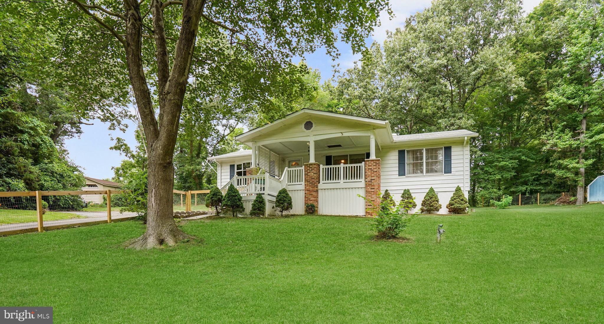 Offer deadline, Monday at 12pm. Exceptional and well-maintained single-level home privately situated on a cul-de-sac boasts thoughtful upgrades. Beautiful and functional design meets comfort in this wonderful home with quality craftsmanship and details including a flowing floor plan, a cozy fireplace, updated kitchen and baths, luxury vinyl plank flooring, recessed lighting, and more. A generously sized 1.21-acre lot backing up to trees and foliage and a fully fenced yard including the front, side, and backyard ensure privacy while integrating the property with its natural environment in the most beautiful way. As you step inside, you are greeted by the open-concept floor plan seamlessly connecting the living, dining, and kitchen areas, creating an inviting atmosphere. Large windows including the front bay window flood the space with natural light, illuminating the stylish flooring and tasteful finishes. The living room is a cozy haven, featuring an electric fireplace as the focal point that provides a warm ambiance for gatherings with family and friends. Whether you're a culinary enthusiast or enjoy simple home-cooked meals, the kitchen offers both functionality and style featuring a fresh color palette with timeless mint cabinets and white brick backsplash, an added pantry, and ample counter space. A breakfast bar and casual dining area make this perfect for entertaining and everyday comfort. The separate dining room offers a wonderful space for enjoying delicious meals with loved ones. At the end of the hall, the primary bedroom boasts a spacious layout and a tranquil atmosphere. It features an en-suite bath with a vanity and a separate shower. The additional bedrooms are equally impressive, offering ample space, and easy access to a second design-inspired full bath highlighting an updated vanity, light fixture, and subway tile design shower surround. Sip your morning coffee on the sizable covered front porch. The property also comes equipped with two sheds, one with electricity, as well as a whole-house generator. In proximity to US-301, MD-5, Pax River Naval Base, shopping, dining, and entertainment options. Property Updates: recessed lighting in all rooms, interior paint, luxury vinyl plank, fence, remodeled hall bath, fireplace, refrigerator, pantry, ceiling fans, light fixtures, and more!