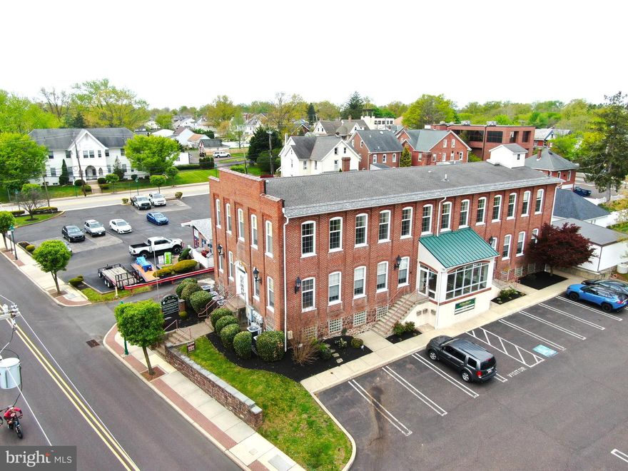 First Class Commercial Office space in excellent condition and ready for your business. All renovations have been completed and creates a versatile configuration. Currently the property is set up with 4 separated office units. Two larger units  with approximately 3200 square feet and two smaller units with approximately 800 square feet.  All walls can be reconfigured since the supports posts are centrally located...make more units, less units the choice is yours.  Interior was strategically designed to maximize as much natural light into the building as possible. Details as follows: 2 kitchens, 5 bathrooms, 6 heating and cooling units, and a mixture of refinished wood flooring, carpet and tile.  Owner tastefully replaced the large windows with double-hung custom windows and placed beautiful sconce lighting on timers on the side and front entry level and "period" light poles in the parking lot.  The building has two entries to the 19 x 14 cathedral foyer with a wide grand staircase.  It boasts 4 electric meters, gas in the street, both verizon and xfinity in the building and all 5 bathroom are ADA compliant. **Hatfield Boro electric **Roof 12 years old**Abundant basement storage**storage shed.  There are 5 units that are being leased; 4 office spaces and  basement space. There are possibilities for a lift, ramp, or other possibilities for entry to expand the possible uses of this building.