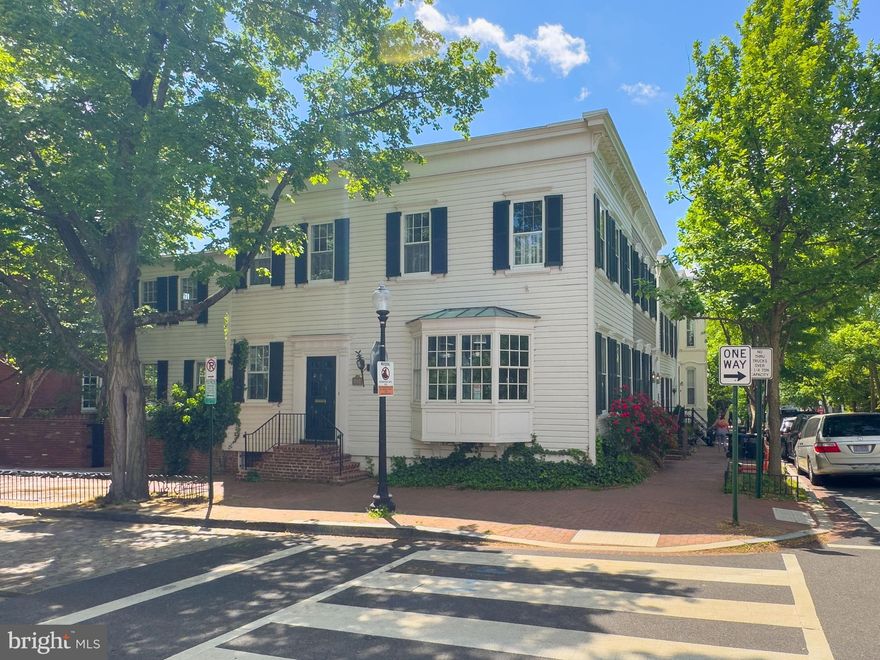 Welcome to 3344 P Street NW — a quintessential Georgetown row house tucked away on one of the neighborhood’s most picturesque cobblestone streets. This beautifully maintained home exudes timeless character, enhanced by abundant natural light from its desirable northern and western exposures. Thoughtfully updated while preserving its historic charm, this residence offers elegant living across three levels. The main level welcomes you with a graceful dual-sided entry and formal foyer. A bright and airy living room features two exposures, a bay window, custom built-ins, and a classic wood-burning fireplace. The formal dining room showcases rich wood paneling, plantation shutters, and double exposure, creating a warm and inviting atmosphere. The renovated kitchen is filled with natural light and equipped with stainless steel appliances and butcher block counters. A powder room and coat closet offer added convenience, while the private, fully fenced patio and garden provide an ideal space for entertaining or quiet outdoor enjoyment. Original pine flooring adds warmth and continuity throughout. Upstairs, the spacious primary suite includes generous closet space and a fully renovated ensuite bathroom. Two additional well-proportioned bedrooms and a beautifully updated hall bath complete the upper level, with original pine flooring continuing throughout. The lower level offers a dedicated laundry area with washer and dryer, additional storage, and utility space. Modern comforts include central air conditioning paired with efficient radiator heating. Located in the heart of Georgetown with a Walk Score of 95, this home offers unparalleled access to the neighborhood’s best amenities. Just steps from M Street and Wisconsin Avenue, enjoy high-end boutiques, charming local shops, and a variety of top-rated dining options such as Filomena Ristorante, Martin’s Tavern, Chez Billy Sud, and Cafe Milano. Nearby cultural landmarks include the C&O Canal, Dumbarton Oaks, and Tudor Place, while Georgetown Waterfront Park provides scenic trails and outdoor recreation. Commuting is easy with multiple bus lines and the nearby Foggy Bottom-GWU Metro Station.