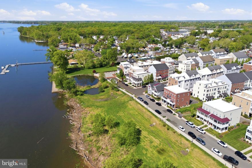 Welcome to one of the most desirable homes in Waterside—an upgraded Annapolis Grand model by original builder Mignatti, and one of only 8 rare side-by-side models.  The sellers opted for all upgrades to provide optimal convenience and affordable luxury. 

Offering approximately 2,310 square feet, this home layout is larger than similar models, offering an expanded breakfast nook with extra cabinetry, a wet bar and beverage fridge.  The premium upgraded kitchen is designed with quartz countertops, island sink, glass pendant lighting, tiled backsplash, a double door pantry, and newer stainless steel appliances: GE Profile Café gas range, matching microwave (2025) and a Bosch dishwasher (2025). The rest of the 2nd floor includes crown molding, recessed lighting, engineered hardwood floors, access to your custom marble tiled powder room, and balcony showcasing the best unobstructed waterfront views in the whole neighborhood! The entire home is filled with natural light thanks to five additional eco-friendly windows to help save energy. 

Follow the new pine wood stairs to the third level hosting three carpeted bedrooms, hall bathroom with tub and laundry area with newer washer (March 2026). The primary suite is located near the front of the home to wake you up with sunrises every morning and includes a spacious walk-in closet and en-suite shower stall bathroom with his and her sinks. 

The ground-level flex space has provided the sellers with many uses throughout the years as a  gym, den, game room, guest room, and currently as an office. Access your oversized 2-car garage, equipped with custom built-in storage shelving, refrigerator and dart board. Guest parking is never an issue with a rear driveway for 2-3 additional vehicles. This exclusive location also offers the benefit of a side yard rarely found in townhome living.

Additional highlights include gas heat with forced hot air, built-in system humidifier, 3-zone Nest thermostats, hardwired sprinkler and fire alarm system and keyless entry.

Location is truly convenient with quick commute routes to Philly, Trenton, or the Jersey Shores via I-95 or the Cornwell Heights regional rail station. And with local favorites such as Waterside Cafe and Broken Goblet Brewing, you don't even have to leave!

Lastly, the sellers are willing to offer mostly all furniture in the home, with valuable items marked negotiable such as the built-in garage Tesla charger or outdoor furniture.  The sellers spared no expense for their enjoyment and are ready to offer the  premium upgrades and prime location for the benefit of the next lucky homeowner!