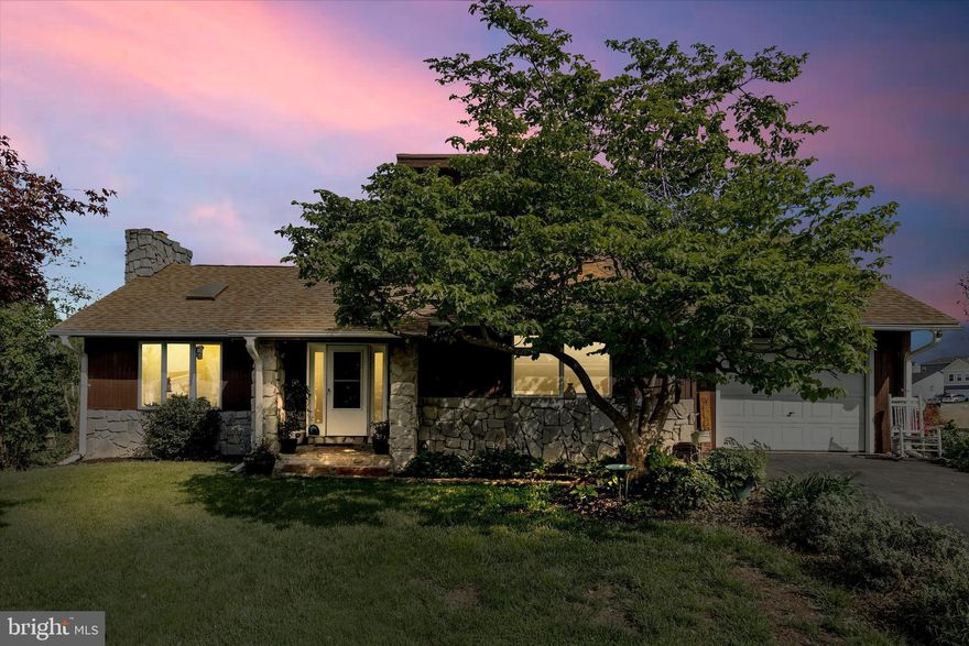 Tucked away on a cul-de-sac in the heart of Thurmont, this striking contemporary home offers a perfect blend of character, comfort, and inviting indoor-outdoor living. Step inside to a bright and airy main level where vaulted ceilings and an abundance of windows and skylights fill the living room with natural light. The stunning stone fireplace creates a warm focal point, making the space feel both dramatic and welcoming. Luxury vinyl plank flooring flows throughout the main level, tying together the open feel of the home. The thoughtfully designed layout includes three bedrooms and two full baths, including a unique loft-style bedroom accessed by a charming spiral staircase (this room needs flooring)—perfect as a guest space, creative retreat, or home office. The primary bedroom offers a peaceful escape with its own skylight and direct access to the expansive rear deck.  Outdoor living truly shines here. A deck that spans almost the entire back of the home and can be accessed from the living room, kitchen, and primary bedroom—ideal for entertaining or simply relaxing. The deck overlooks a private backyard complete with an above-ground swimming pool, creating the perfect setting for summer gatherings. The finished lower level adds even more versatile living space, featuring recreation room with a built-in bar and cozy wood stove. An additional full bath, laundry area, and ample storage space make this level as functional as it is inviting. Walk out directly to the backyard for seamless indoor-outdoor flow.  With its distinctive contemporary style, generous living spaces, and serene cul-de-sac location, this home offers a rare opportunity to enjoy comfort, privacy, and personality all in one beautiful package.